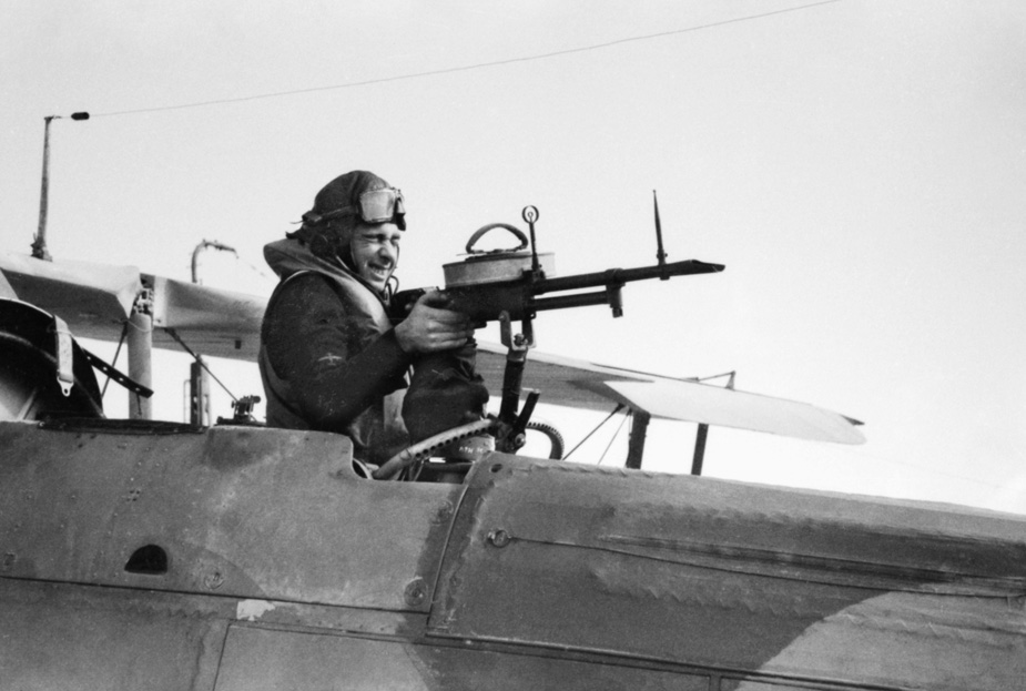 Swordfish gunner poses with his Vickers .303-caliber machine gun aboard the Ark Royal.