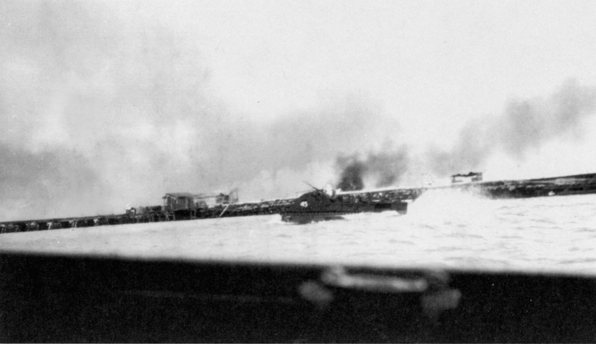 Carrying a squad of riflemen from E Company, 8th Marines, LVT-45 makes its run toward the beach on the islet of Betio at Tarawa atoll.