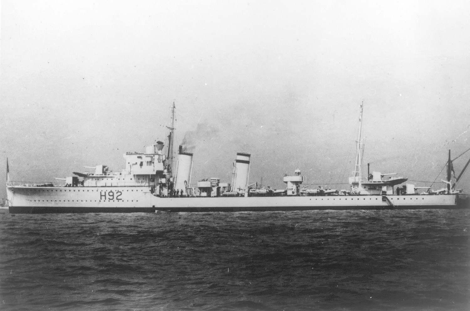 In happier times, the destroyer HMS Glowworm presents an attractive profile. Lightly armed and armored, the little ship nevertheless inflicted serious damage on the German heavy cruiser Hipper. 
