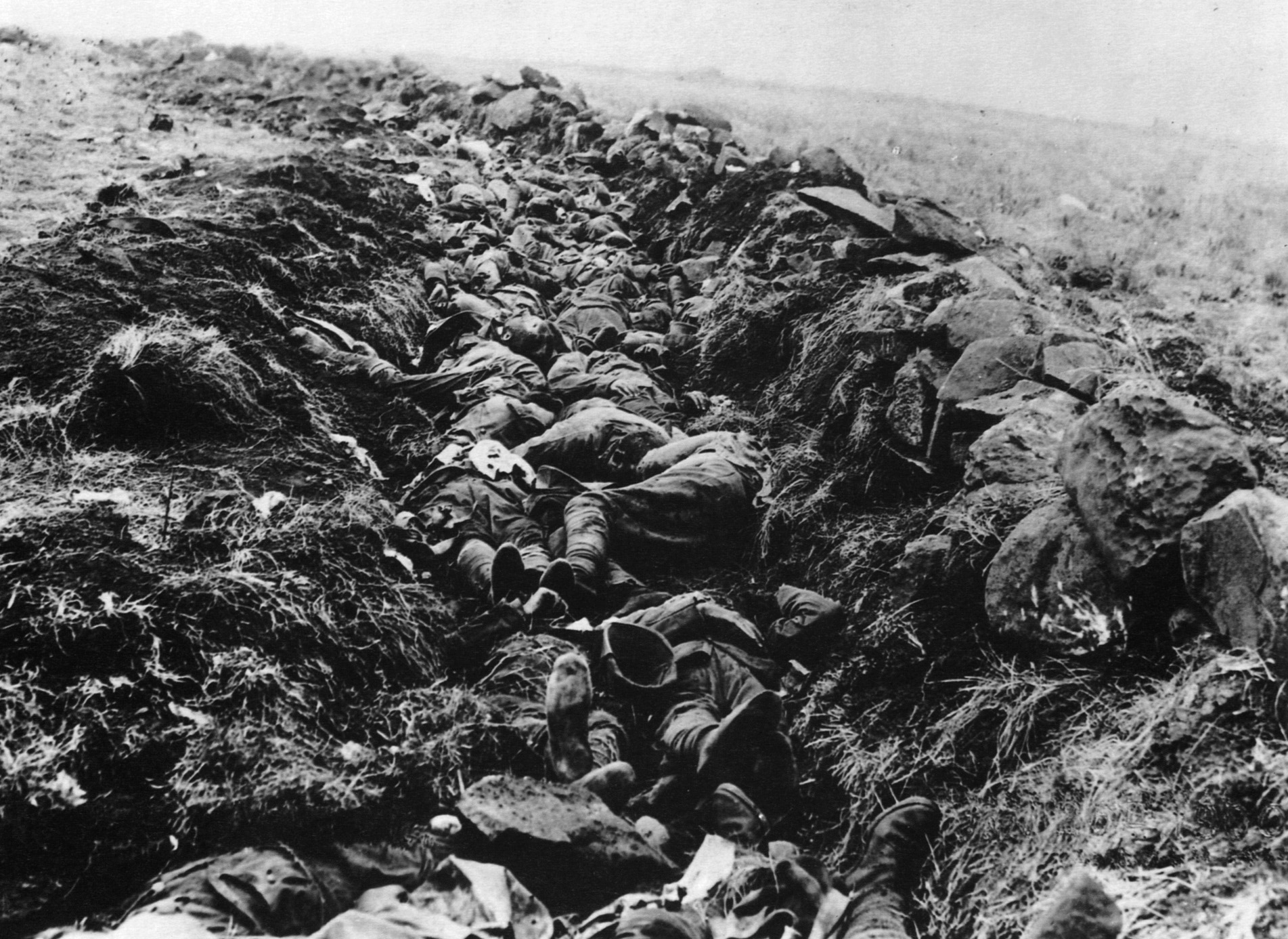 On the morning after the bloody fighting at Spion Kop, a large trench serves as a makeshift grave for some 400 dead soldiers who perished there.
