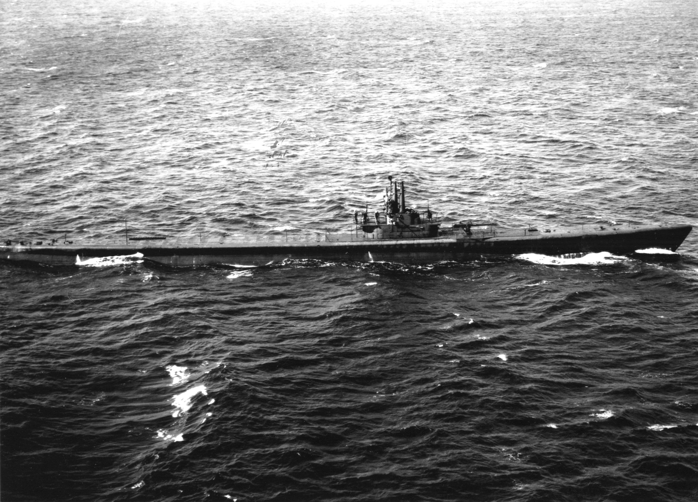On patrol in the open sea, the submarine USS Batfish is photographed from the air on September 20, 1943.