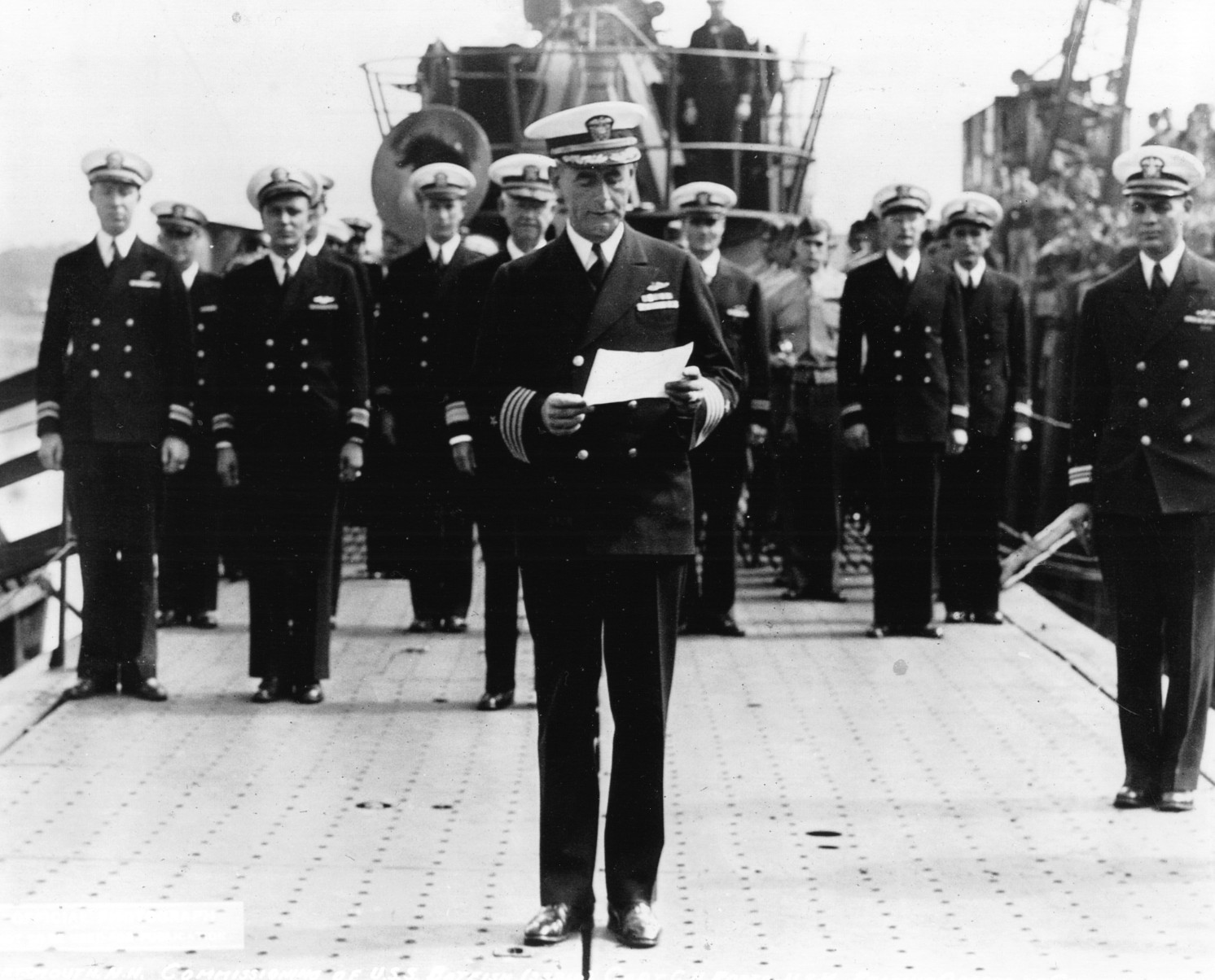 An officer reads orders during the commissioning of the new submarine USS Batfish at the Portsmouth Navy Yard on August 21, 1943.