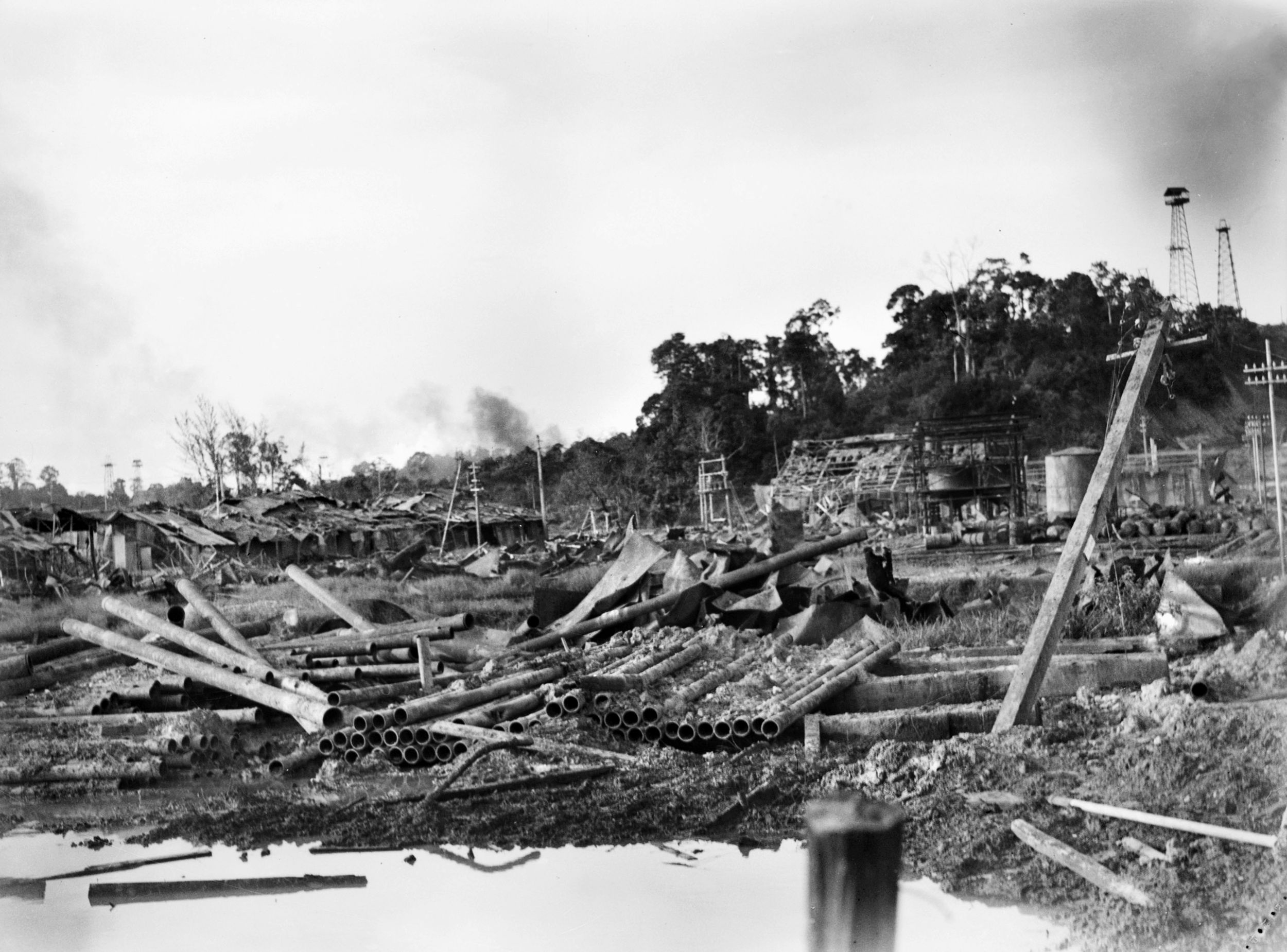 In this photo taken about three hours after the position was secured by 2/4 Commando, Tarakan Hill is shown looking north from an oil field boiler house on May 4, 1945.