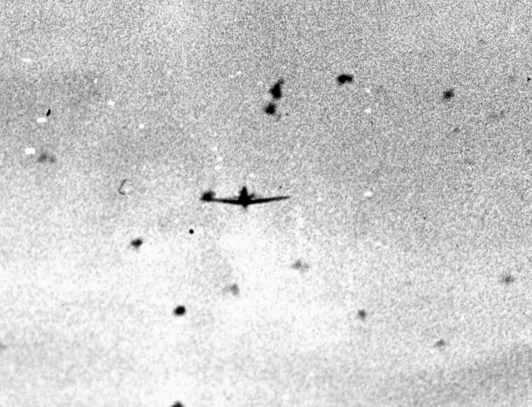 Caught in the gun camera of an attacking American fighter plane, this Japanese dive-bomber was one of hundreds of kamikazes that assaulted the U.S. fleet off Okinawa. A relative few got through the curtain of antiaircraft fire and covering fighters but managed to inflict heavy damage. (National Archives)