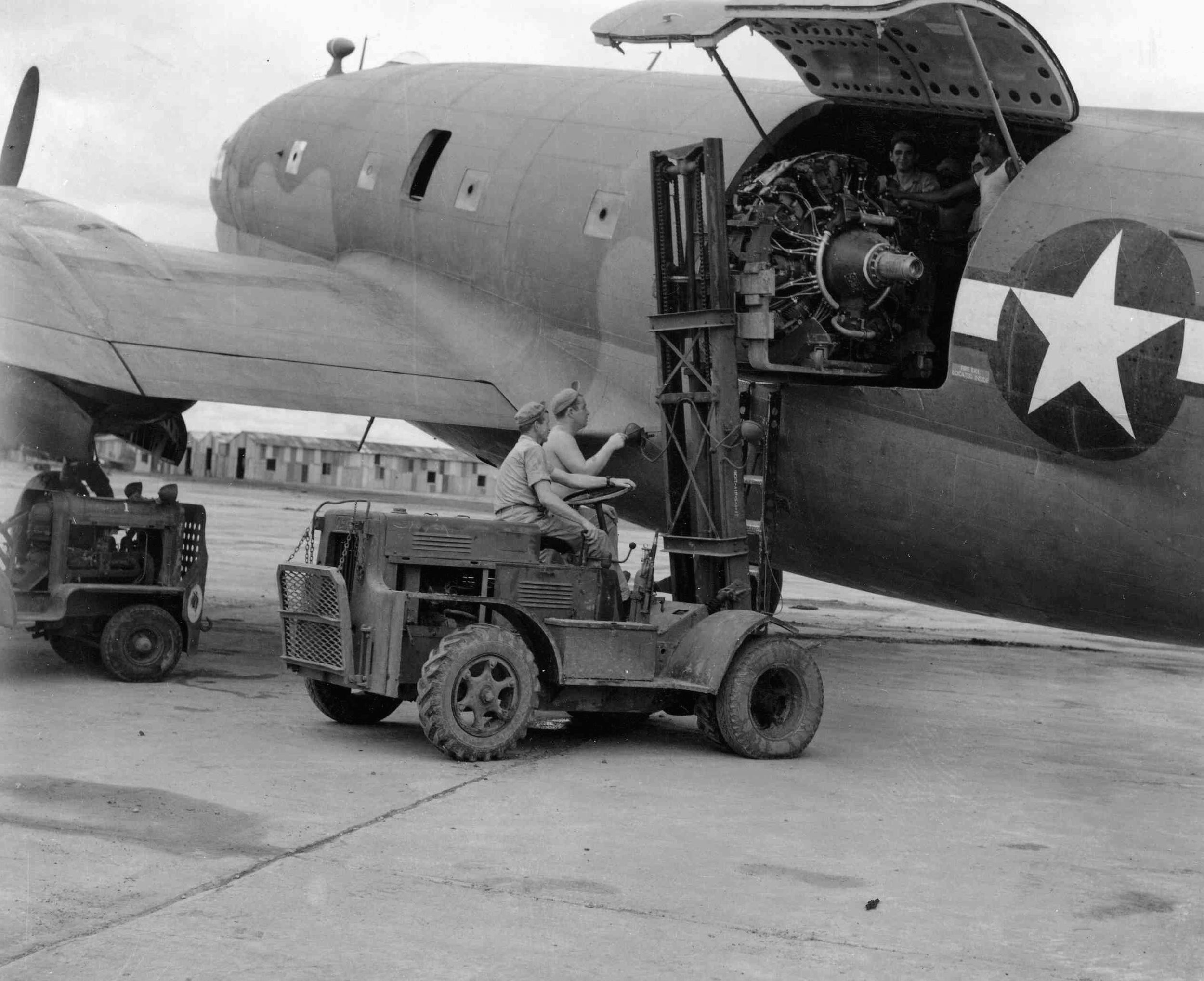 A replacement engine for a Boeing B-29 heavy bomber arrives in China aboard a C-46 transport. B-29 engines and replacement parts were a priority for Hump flights during the effort to mount a bombing campaign against Japan from airfields in China.