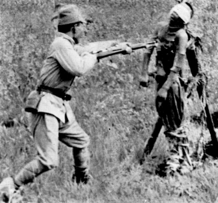 A Japanese officer summarily bayonets a wounded Chinese prisoner. Despite such atrocities, Japanese prisoners were treated generously by their Chinese captors during and after the war. (National Archives)