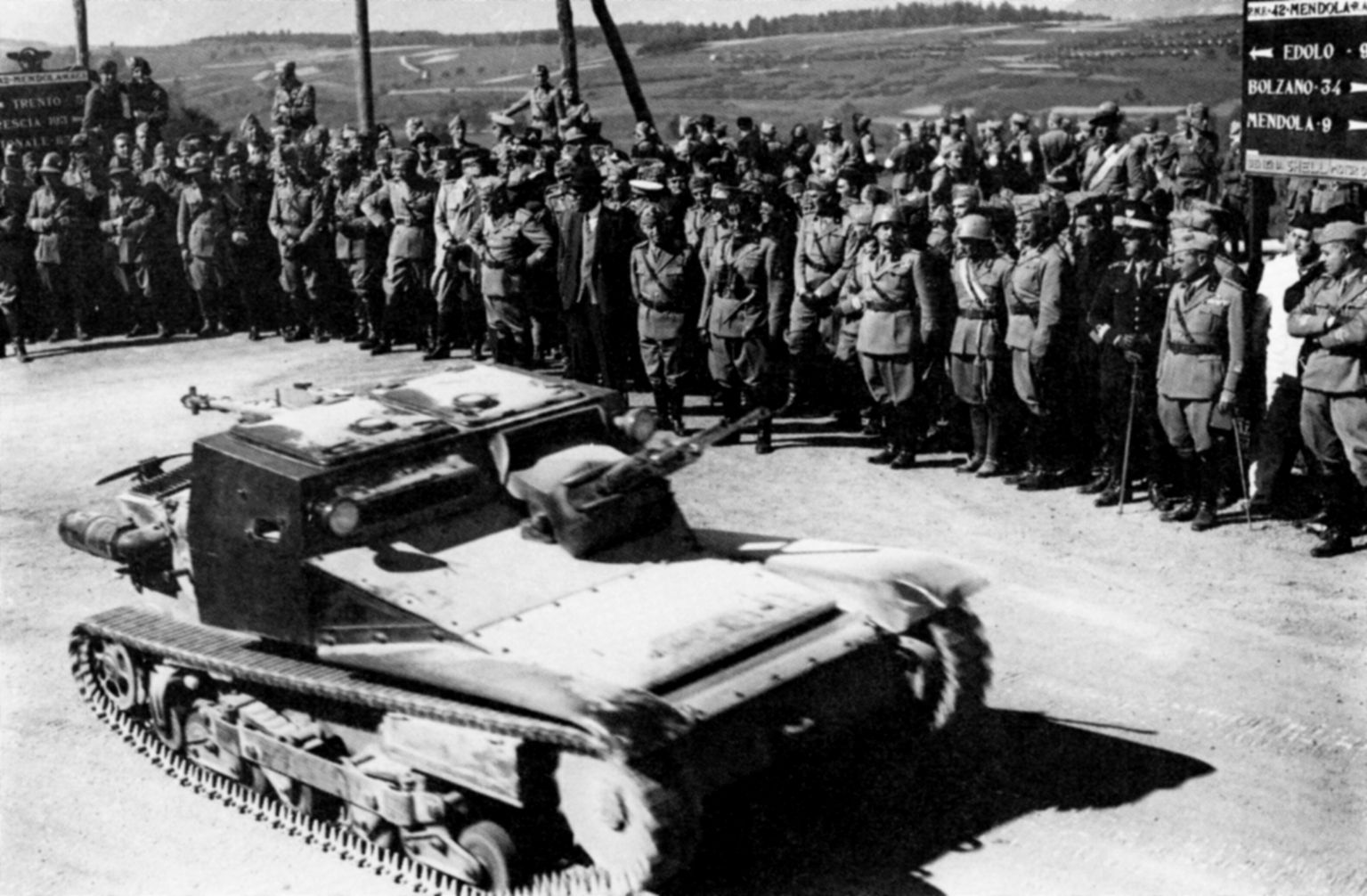 Observing maneuvers near the Austrian border in August 1935, Italian King Victor Emmanuel and Mussolini view a new light tank. Italian armor, though somewhat improved between the world wars, remained inadequate under combat conditions during World War II. (Imperial War Museum)