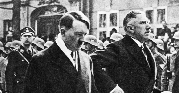 Reich Chancellor Adolf Hitler and Vice Chancellor Franz von Papen proceed to the opening of the Reichstag on March 21, 1933.