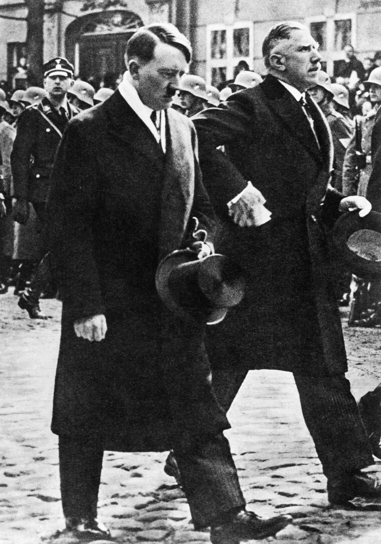 Reich Chancellor Adolf Hitler and Vice Chancellor Franz von Papen proceed to the opening of the Reichstag on March 21, 1933.