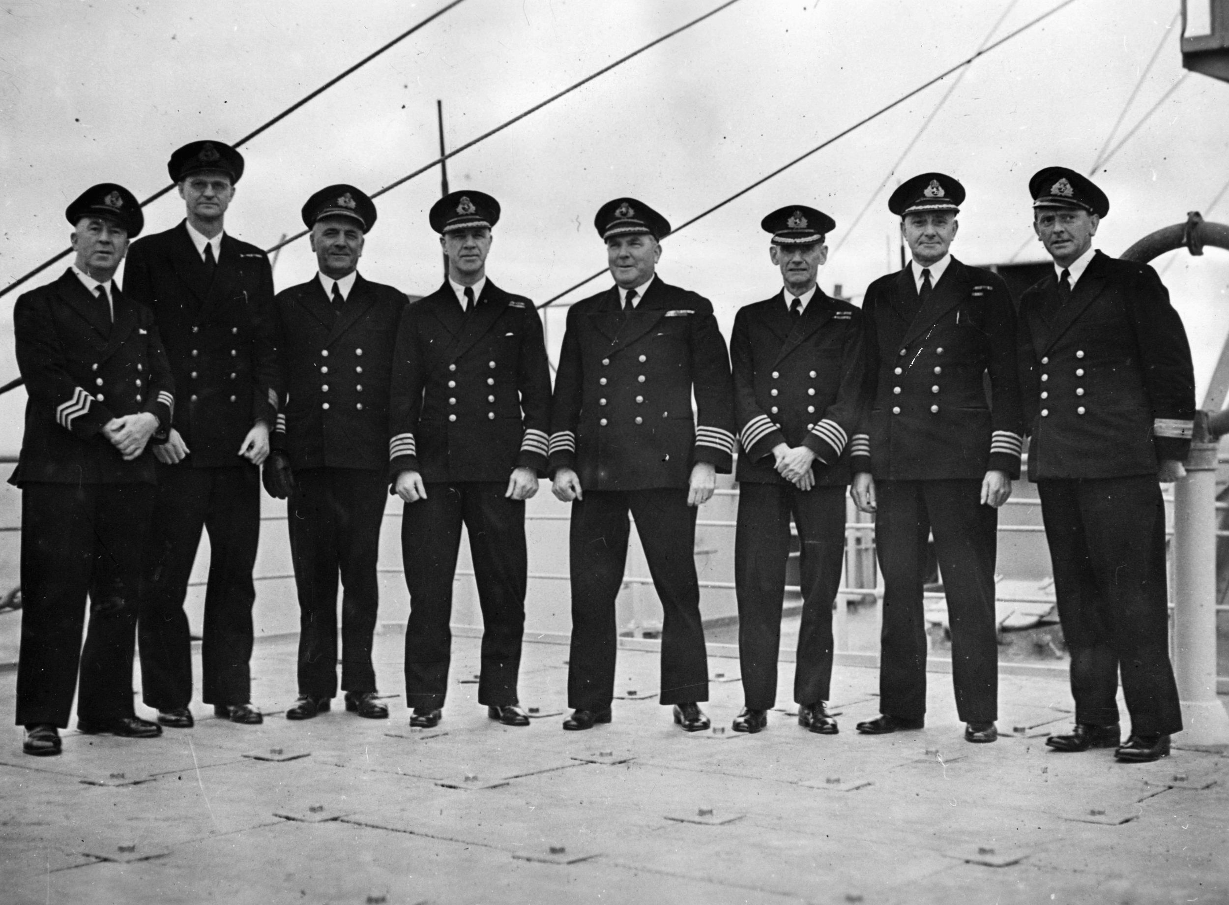 The officers of the Queen Mary pose for a photograph in November 1944. Standing fourth from the right is Captain James C. Bisset.
