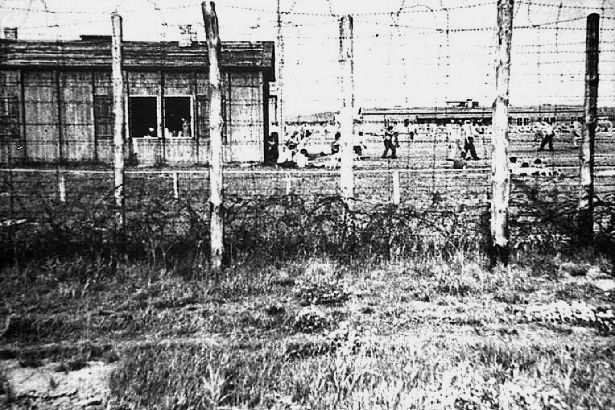 The spartan existence of life in a German POW camp is evident in this photograph depicting Barracks 6.