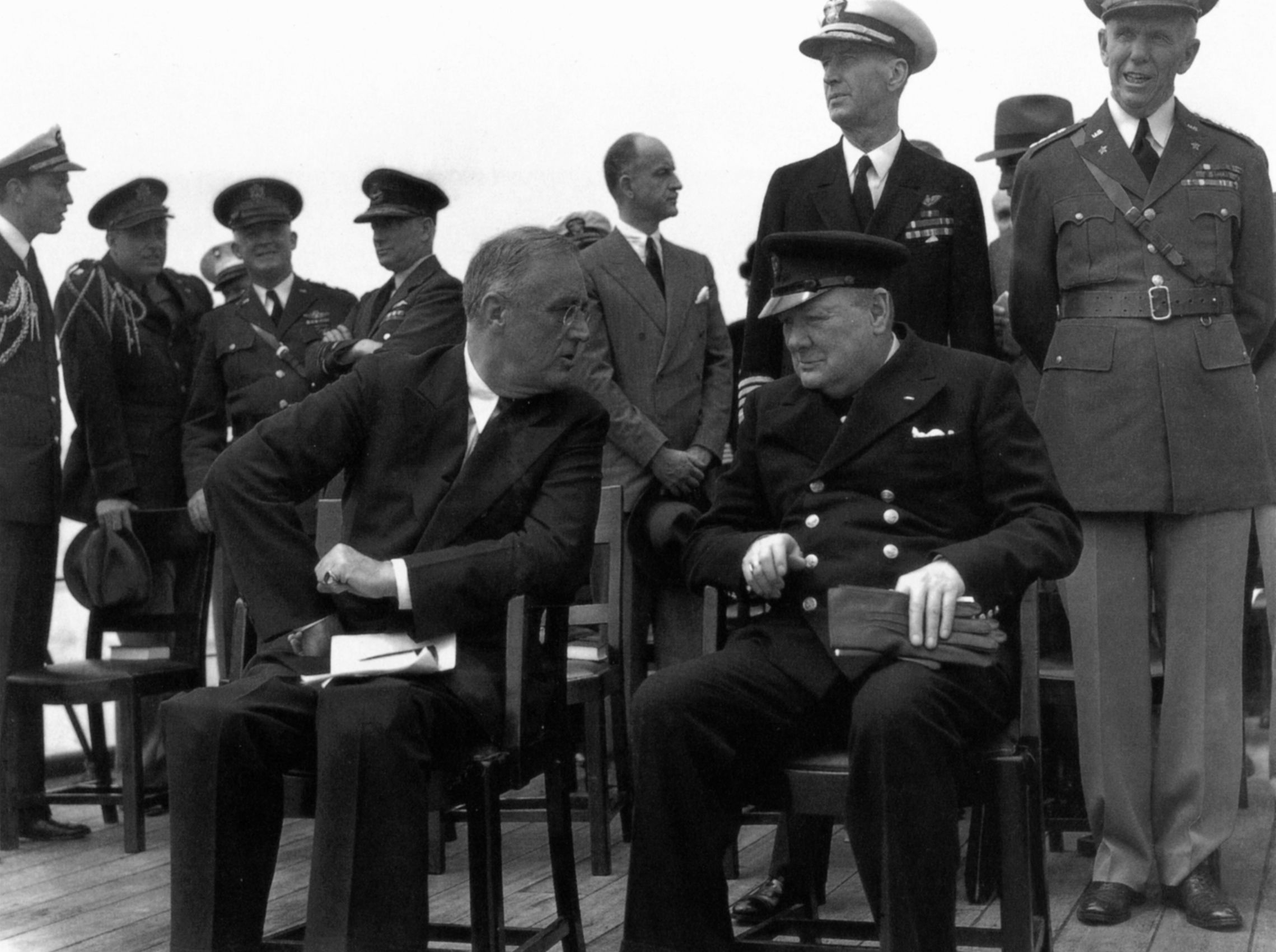 Roosevelt confers with British Prime Minister Winston Churchill during their historic meeting at Placentia Bay, Newfoundland, in August 1941. The leaders drafted the Atlantic Charter during their conference. (National Archives)