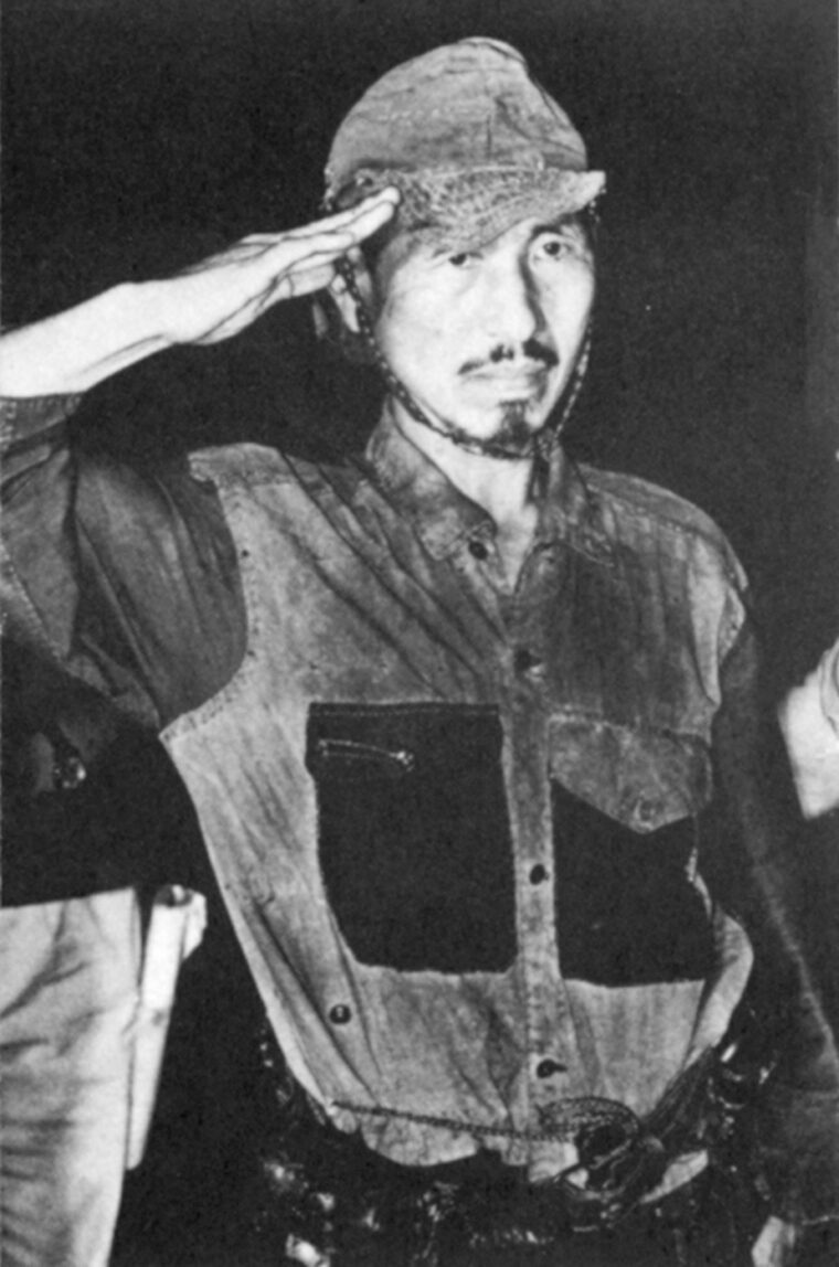 Second Lieutenant Hiro Onoda salutes upon his return to Japan in March 1974 after years of hiding in the jungles of the Philippines.