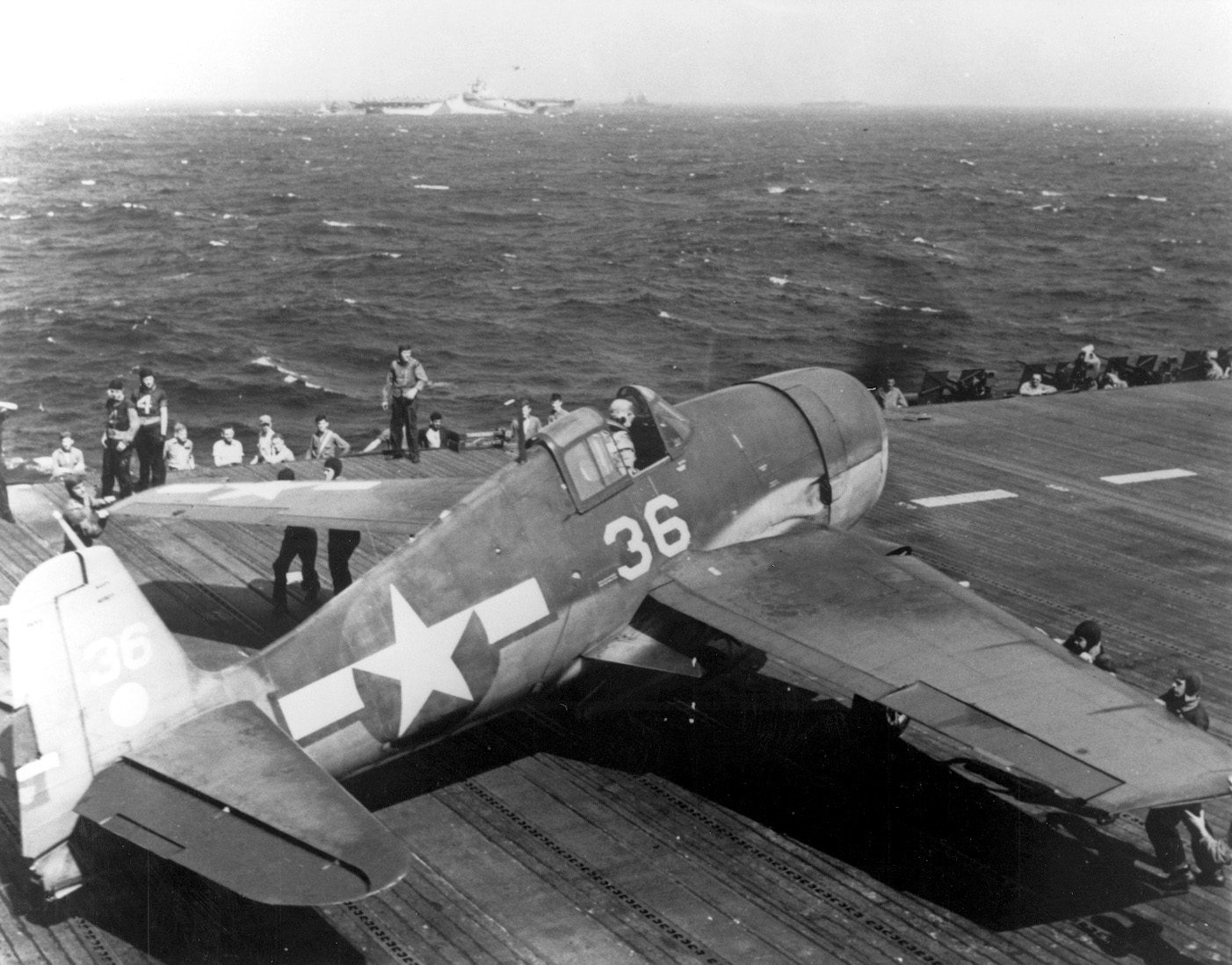 Following a successful raid against targets in the Marianas, a Grumman F6F Hellcat fighter sets down on the USS Hornet. A tough, powerful fighter, the Hellcat ultimately dominated the skies over the Pacific. 