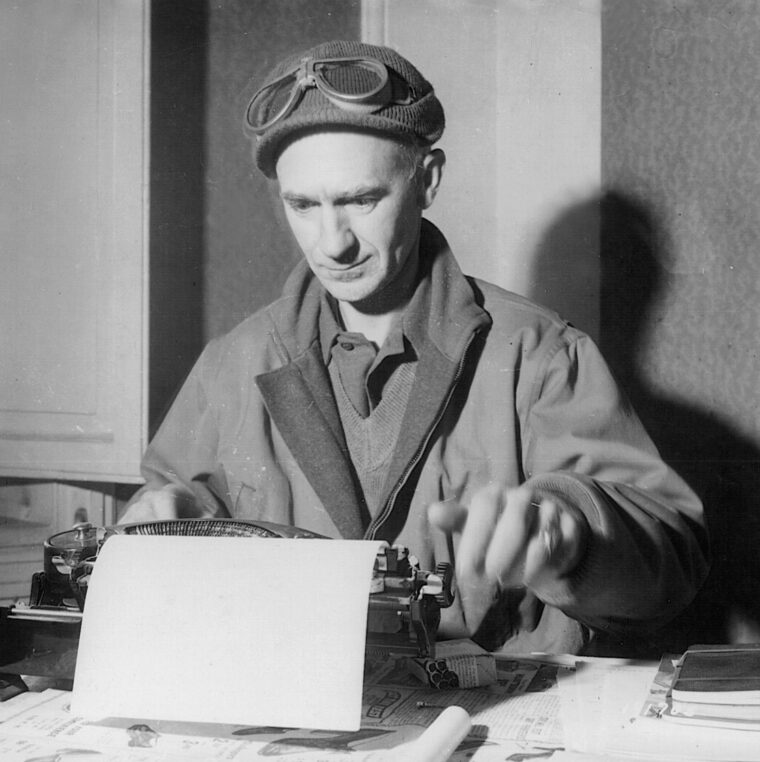 Stationed at his manual typewriter, Ernie Pyle bangs out a column near the front line at Anzio, March 18, 1944. Pyle wrote some of his most insightful and poignant reports during the Italian campaign.