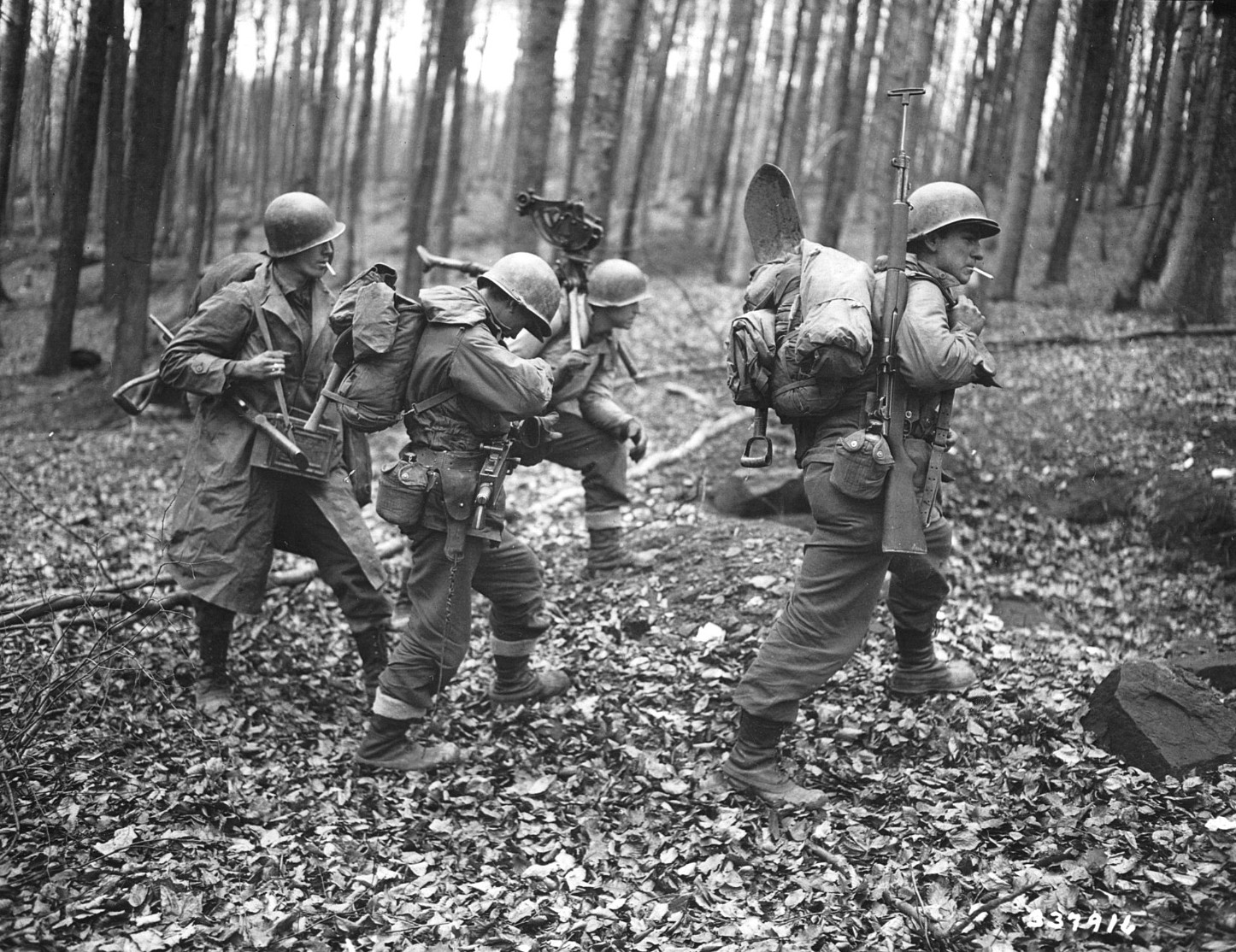 Men of the 100th Infantry Division penetrate the long-dormant Maginot Line at Bitche, in eastern France, en route to Germany.