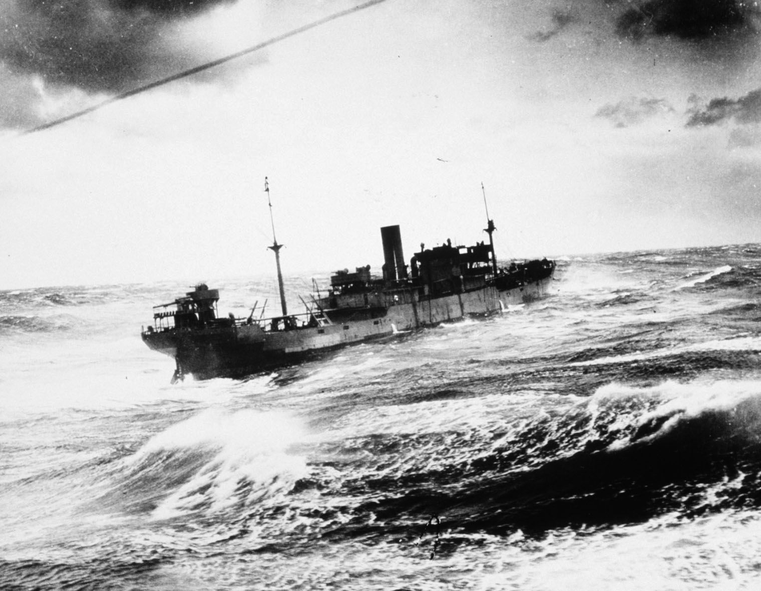 Making the dangerous passage across the North Atlantic to the Soviet port of Murmansk, the armed merchant ship SS Coulmore weathers heavy seas on May 20, 1943. 