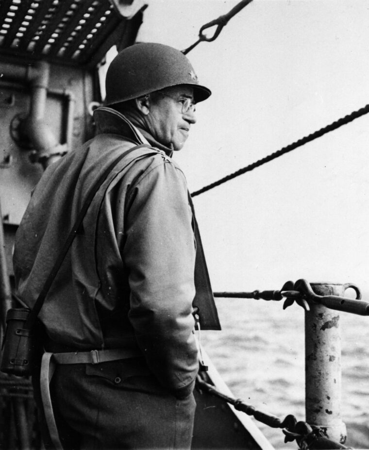 During the difficult early hours of D-Day, General Bradley gazes toward the coast of France. The situation on Omaha Beach was in doubt to such an extent that Bradley considered withdrawing those ashore and diverting later waves to Utah Beach.