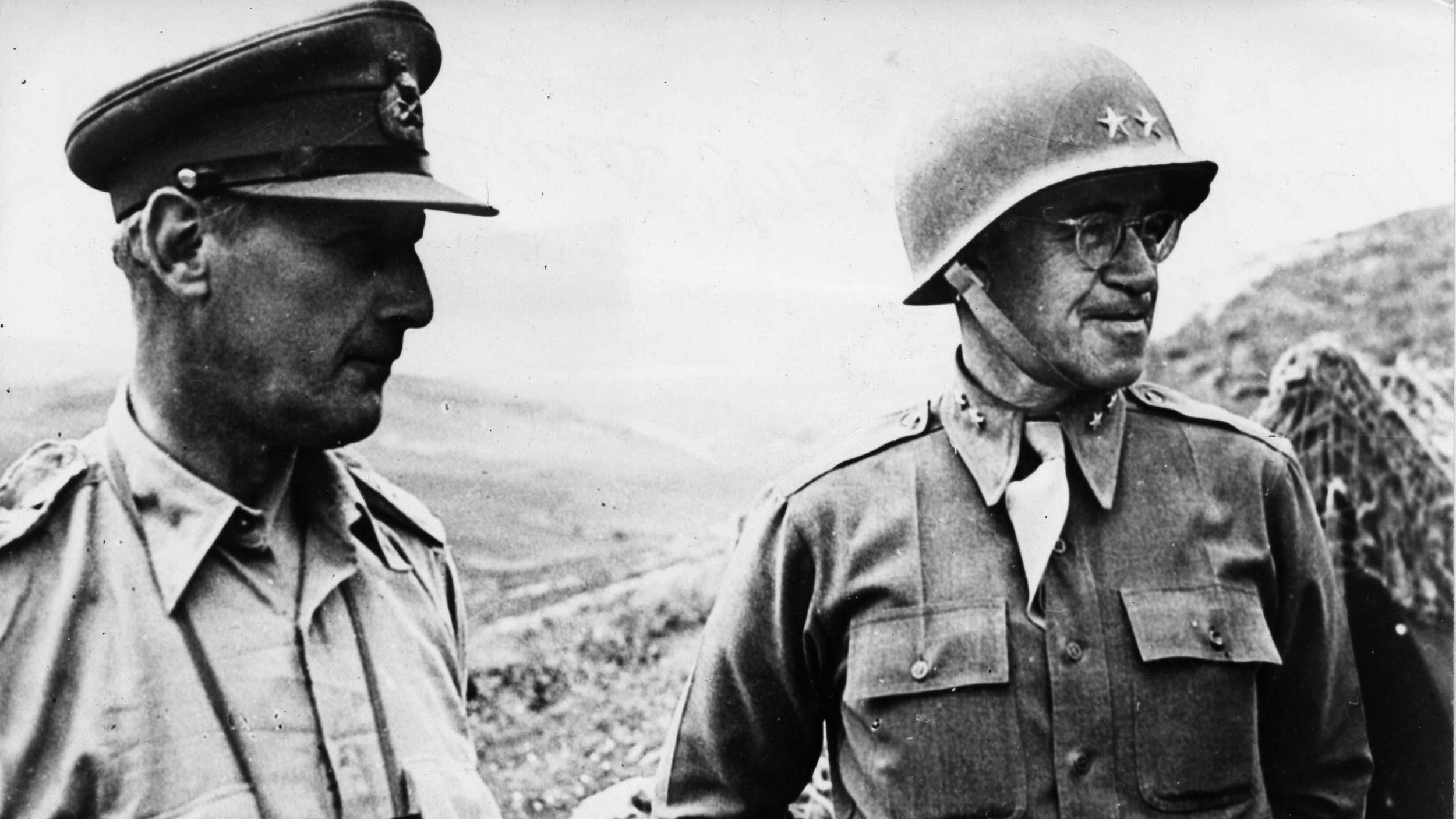 During the fighting in North Africa, General Omar Bradley (right) confers with Lieutenant General Kenneth Andersen, commander of the British First Army, as they inspect positions in Tunisia.