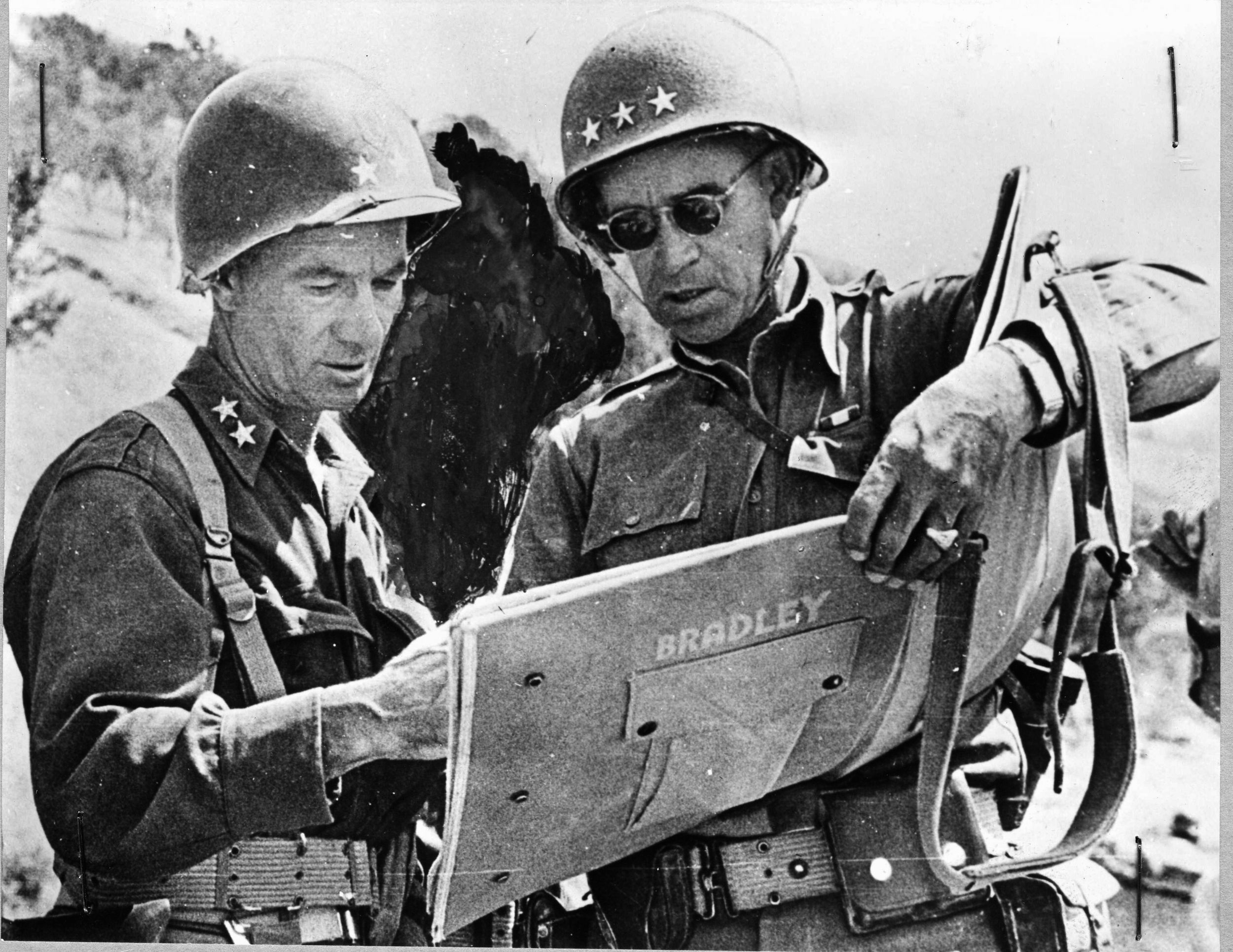 Near the town of South Caterina, Sicily, General Omar Bradley (right) confers with Major General Terry Allen, commander of the U.S. 1st Infantry Division. In Sicily, Bradley served as a corps commander in General George Patton’s Seventh Army. 