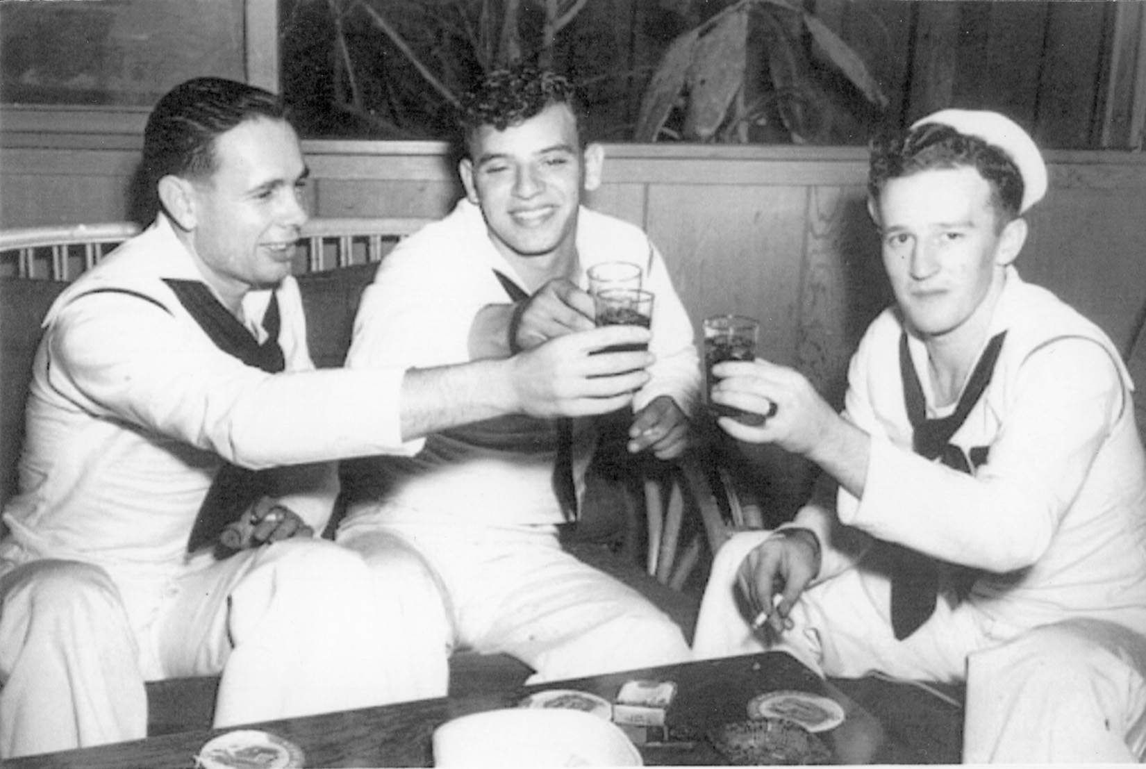 Seaman Clifford Olds (right) enjoys the company of two buddies on the evening of Dec. 6, 1941. Six hours later, he was trapped in pump room A-109 aboard the USS West Virginia fighting for his life.