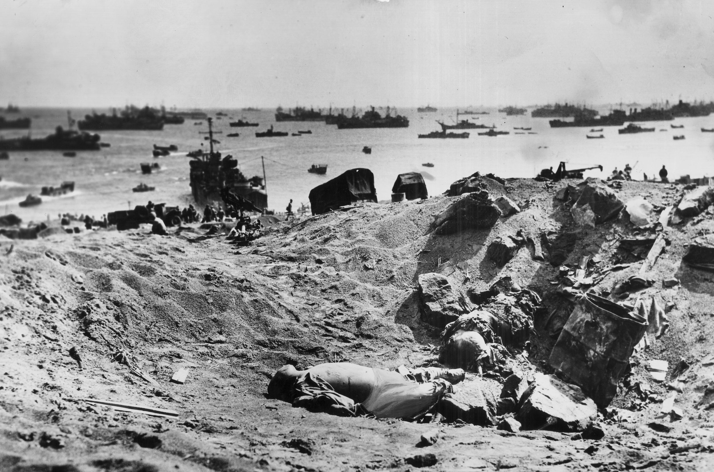 At Iwo Jima, U.S. warships lashed Mount Suribachi with high explosive shells in an effort to silence artillery batteries and machine-gun positions firing on the Marines on the beaches below. Here, Japanese soldiers lie dead in one of the countless craters blasted by the American ships.