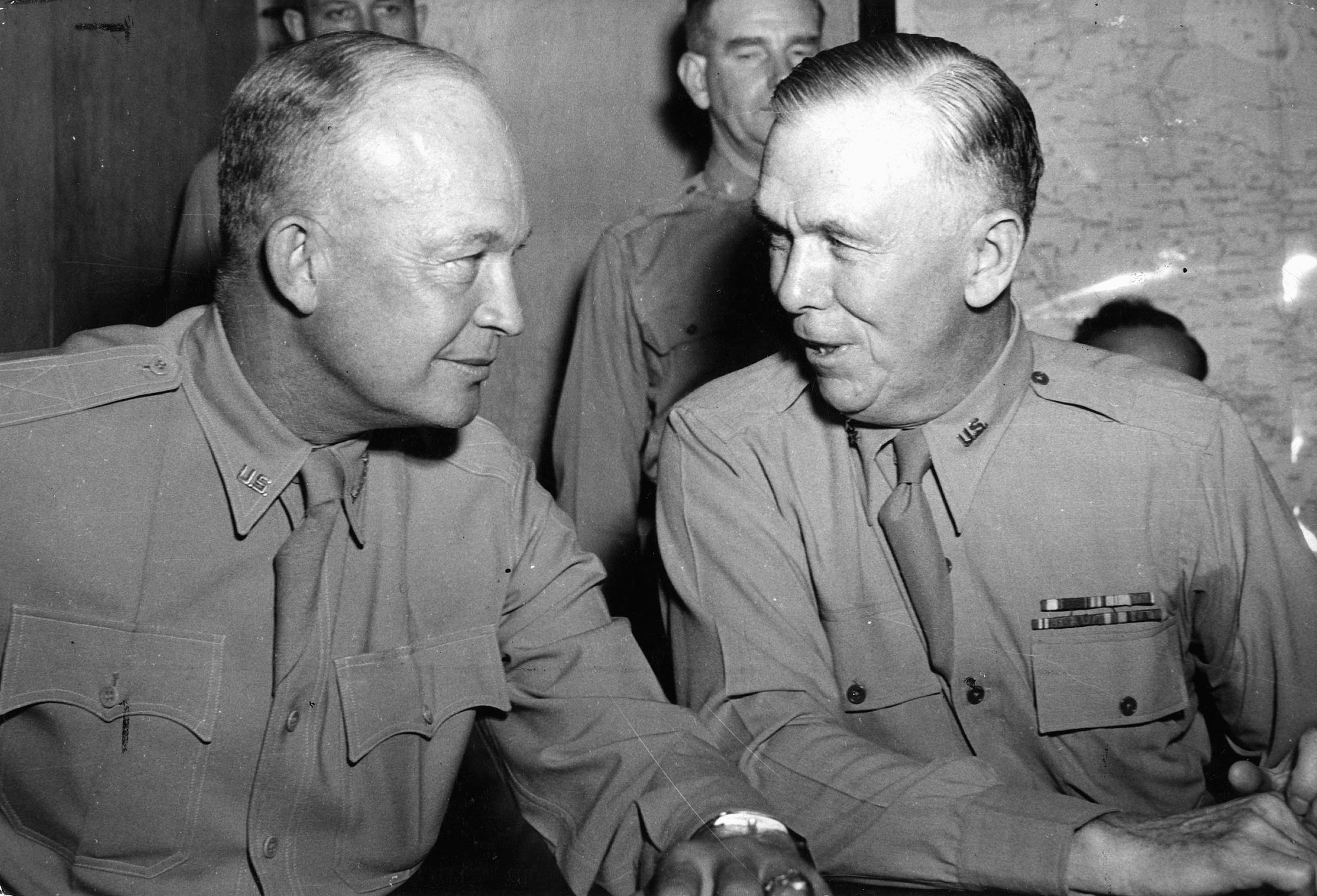 General Dwight D. Eisenhower (left), Supreme Commander of Allied forces in Europe, confers with General George C. Marshall, Army chief of staff.