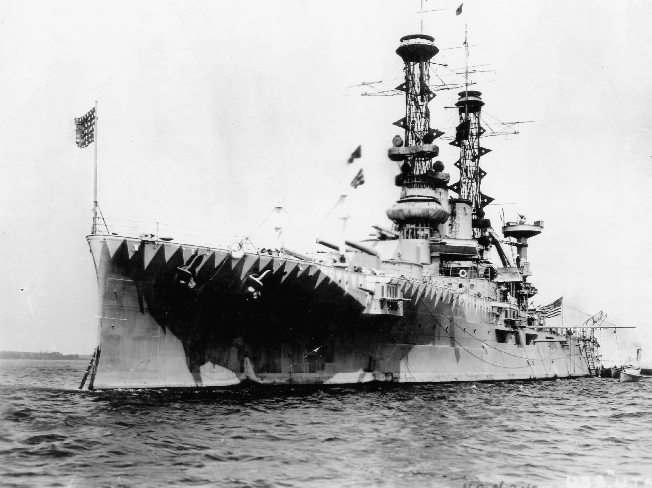Converted to a target ship in 1930 , the battleship USS Utah is shown during World War I in a camouflage scheme intended to confuse the enemy range finders.