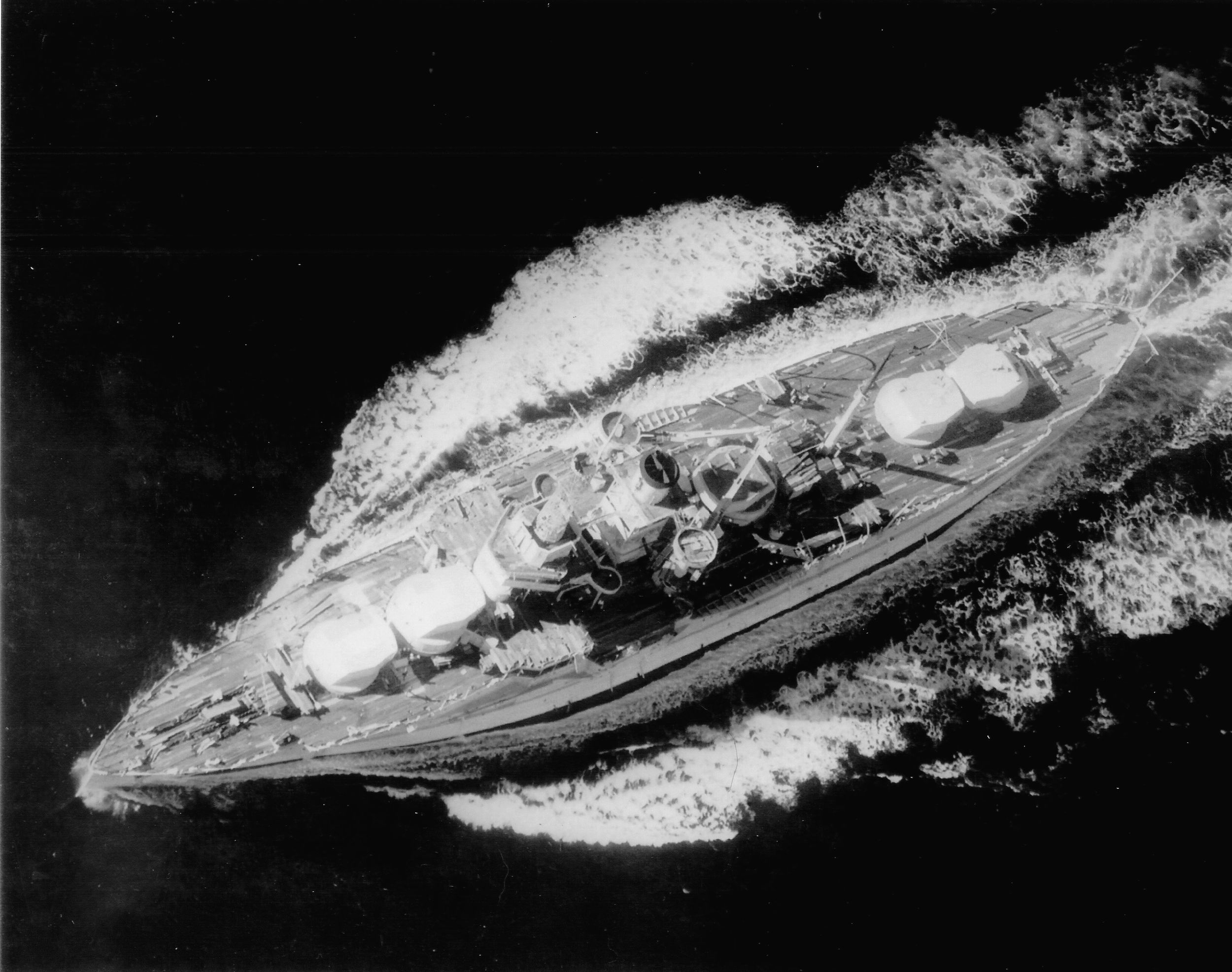 Plowing through the Pacific on December 10, 1936, the USS Utah is employed as a target ship by the navy. Her 12-inch main guns and other weaponry have been removed.