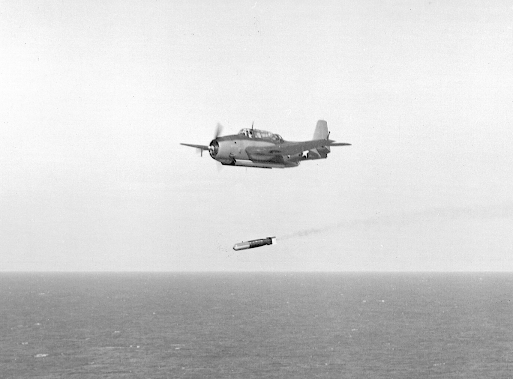 A U.S. Avenger torpedo bomber releases its deadly weapon.