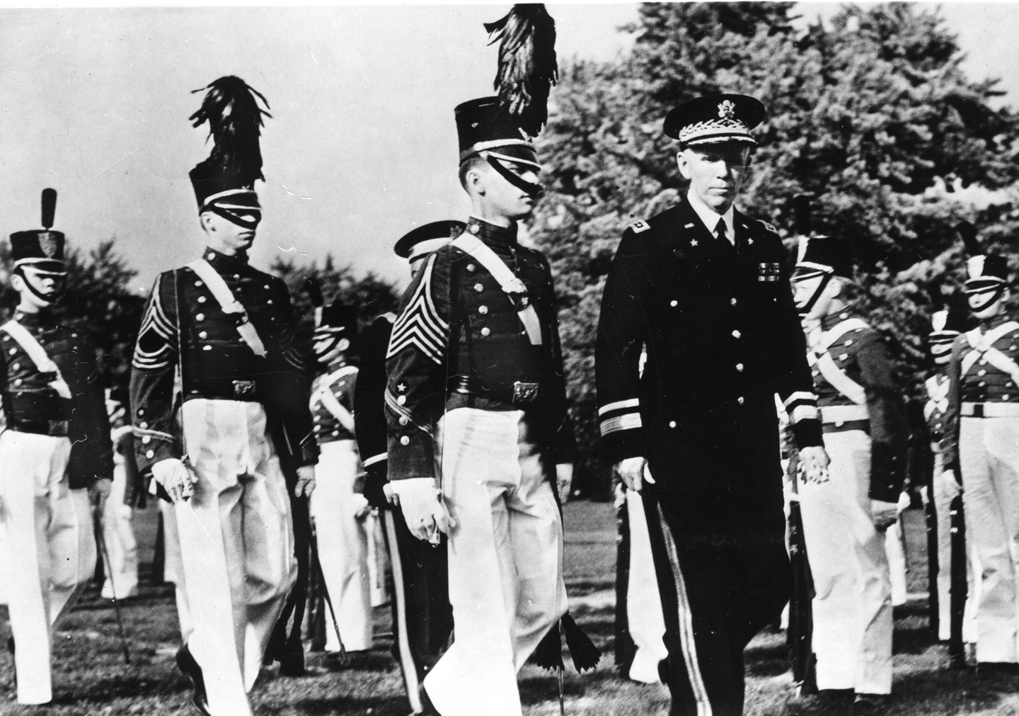 Marshall inspects smartly uniformed VMI cadets in 1940.