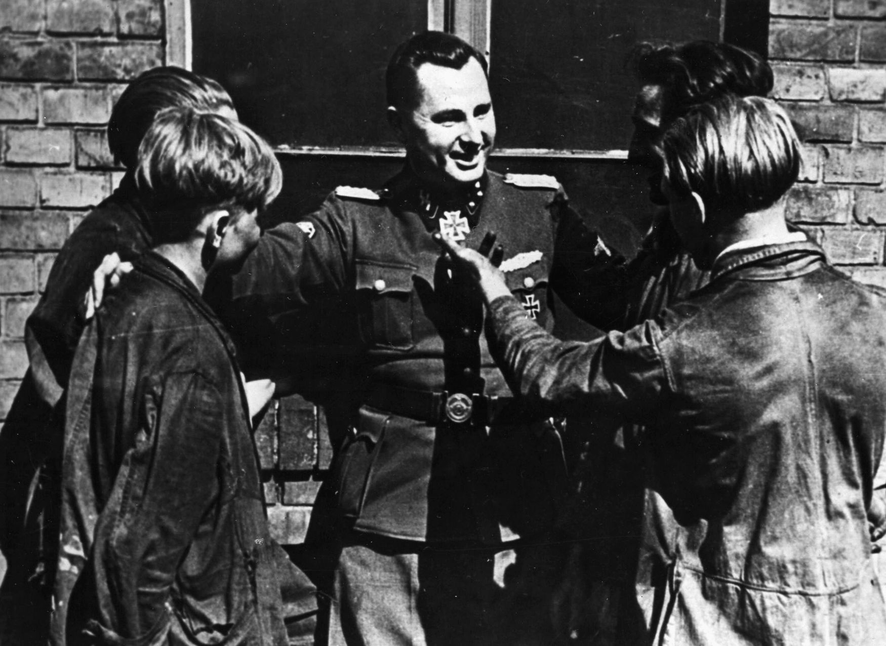 During a visit to Berlin on July 7, 1944, Leon Degrelle talks with Belgian volunteer workers who have relocated to the German capital.