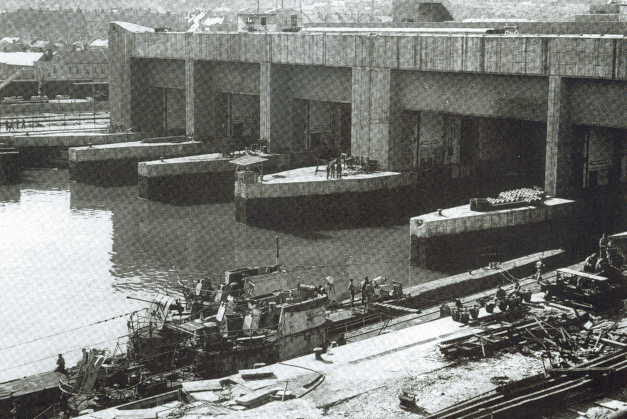 Ian Fleming concocted a number of daring escapades to bring down the Nazis in World War II. One was gathering intelligence on then attacking bomb-proof U-boat pens in France, such as the ones shown here. 