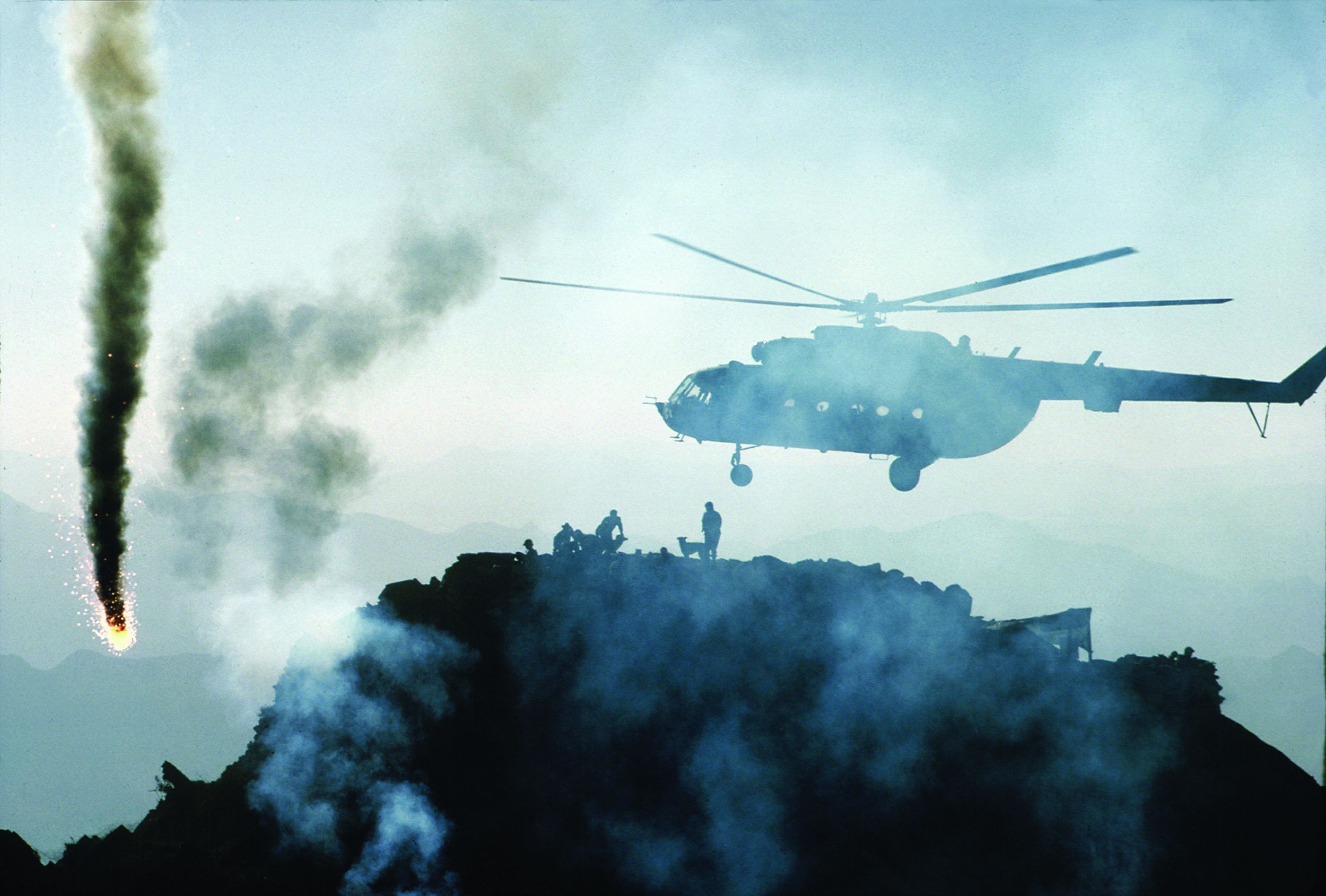 A Russian Army MI-8 helicopter fires on a guerrilla-held hot spot. The Soviets, like the Americans in Vietnam, made much use of helicopters for aerial firepower and troop movements.