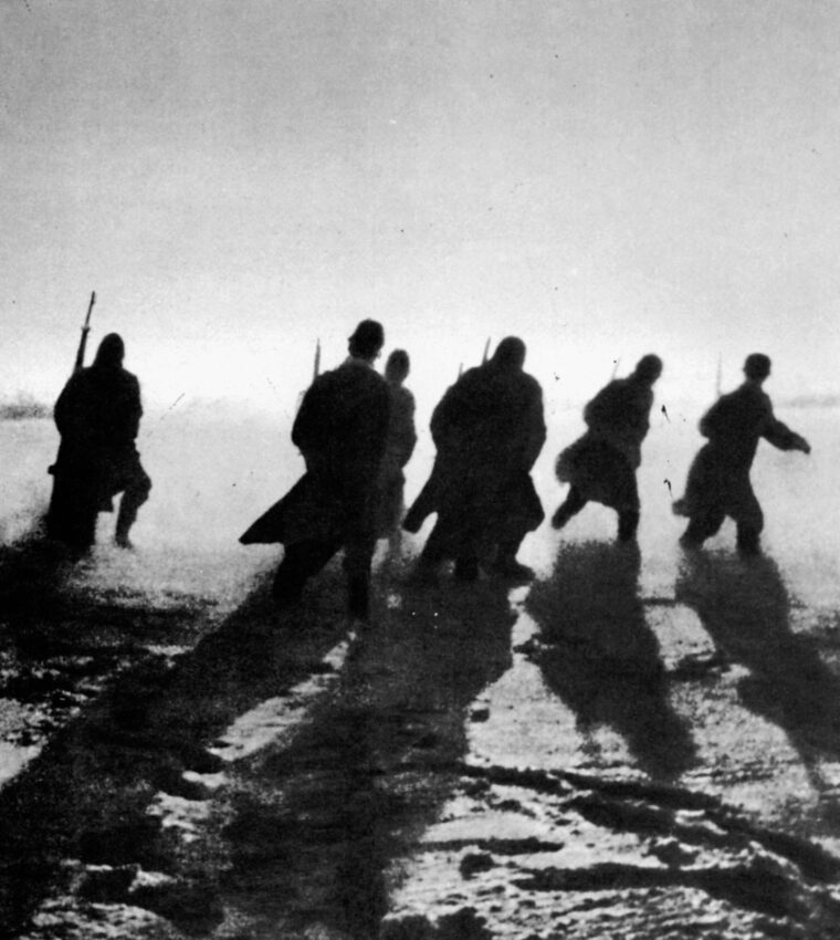Shadowy figures of Soviet infantrymen move out as they are silhouetted by the waning afternoon sun. Red Army soldiers fought bravely in most cases, but those who did not perform their duties faced the summary justice of the political commissars who accompanied combat units.