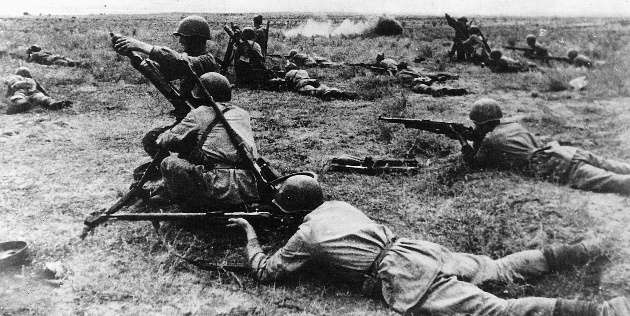 Two Red Army soldiers fire a mortar round as others lay low. Soviet infantry, which many Germans regarded with disdain early in the war, grudgingly gained their respect during the winter offensive of 1941-42.