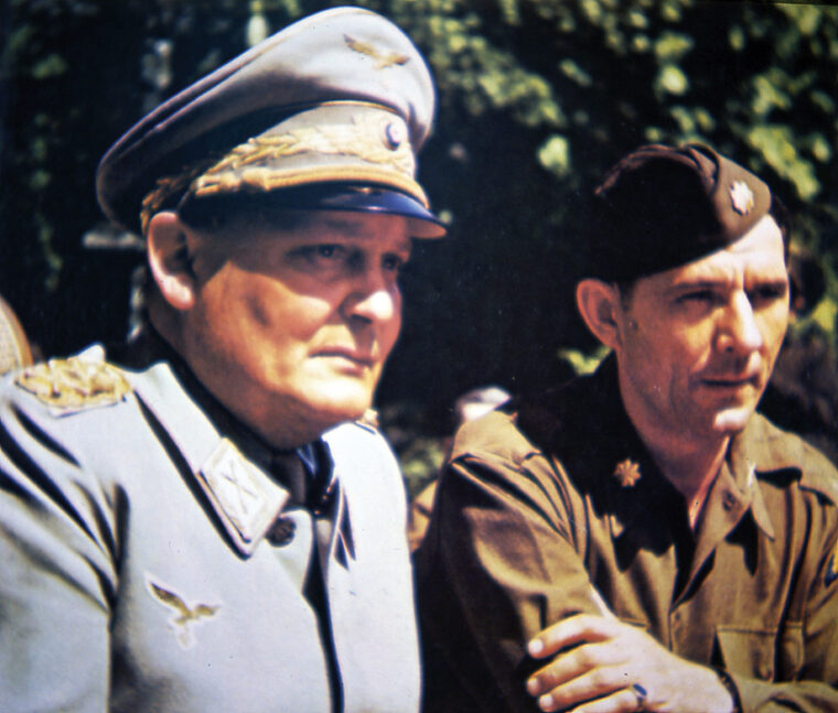 Hermann Göring photographed in captivity alongside an American military officer.