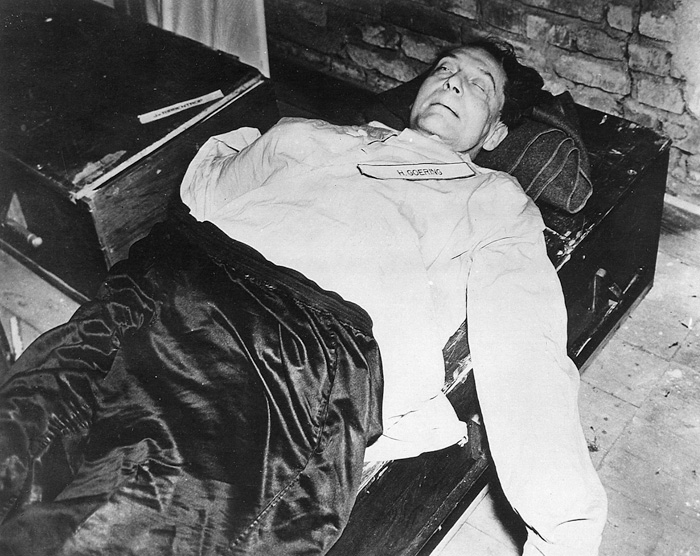 Hermann Göring lies dead shortly after ingesting a cyanide capsule.
