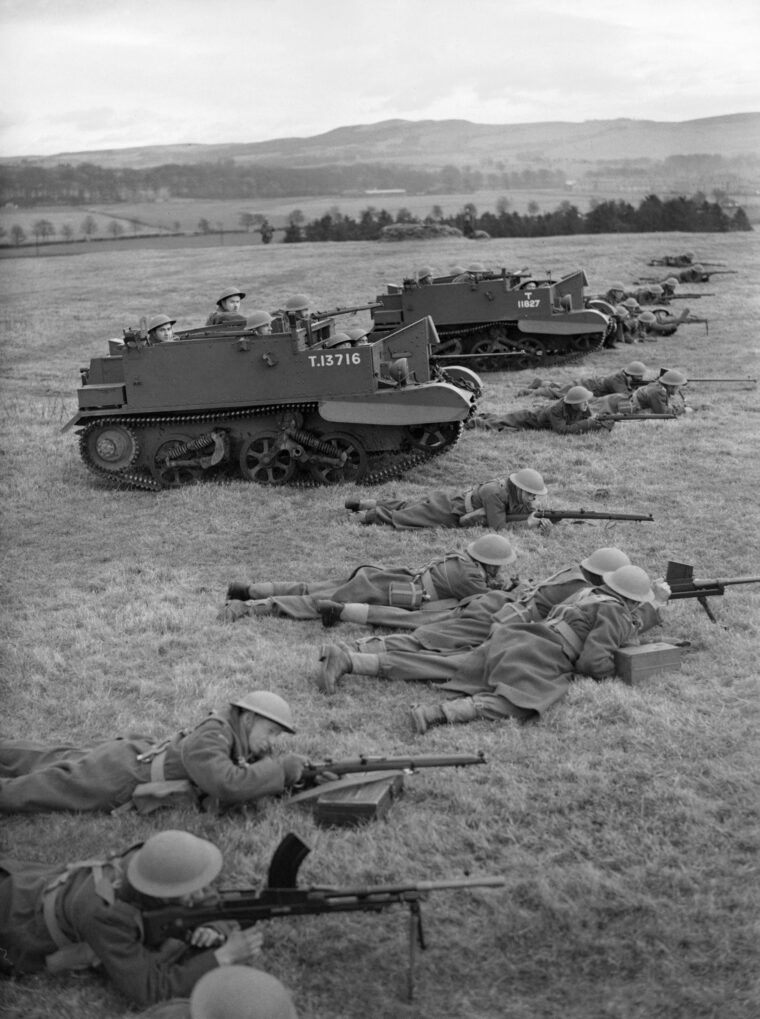During a 1940 training exercise in Scotland, Polish infantrymen aim Boys antitank rifles and Bren guns downrange. Universal carriers with other soldiers aboard are also visible.  (All photos: Imperial War Museum)