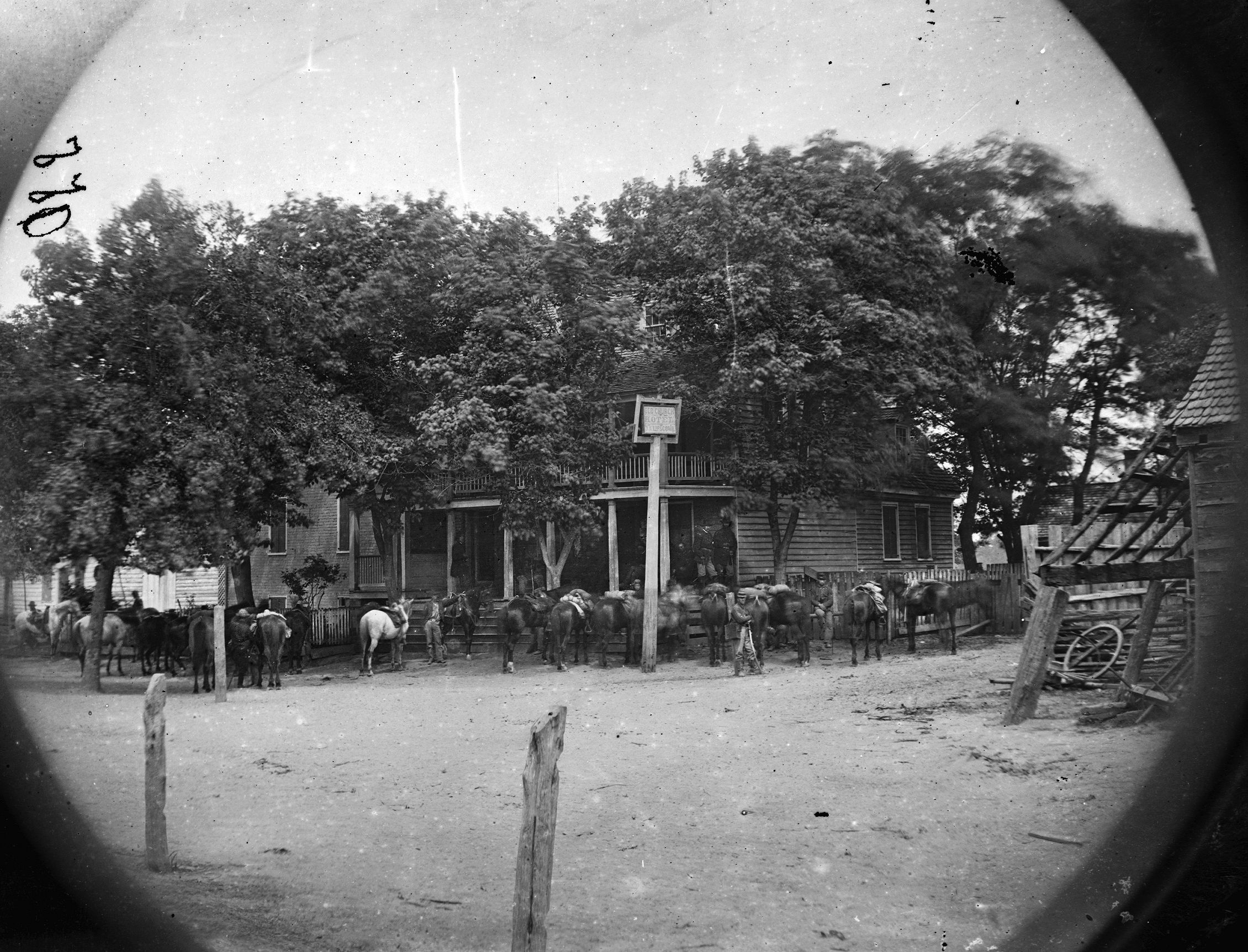 Union cavalry horses are tethered around the Old Church Hotel near Cold Harbor, Virginia, which functioned as Maj. Gen. Phil Sheridan’s headquarters during the run-up to Trevilian Station.