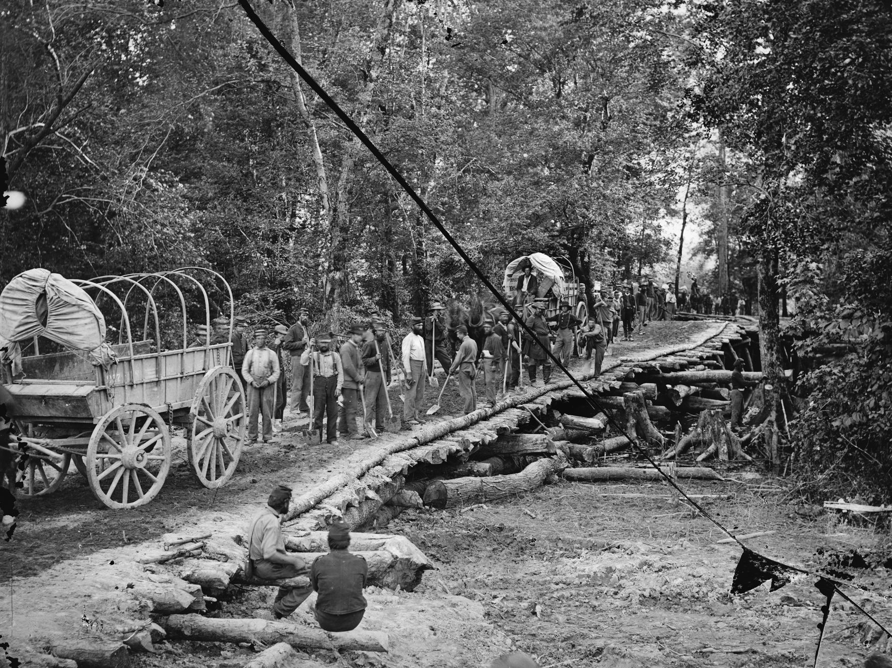 Members of the 5th New Hampshire Infantry admire their work on the hastily constructed Grapevine Bridge across the Chickahominy River at Seven Pines. The rough bridge was crucial to funneling reinforcements to the battlefield.