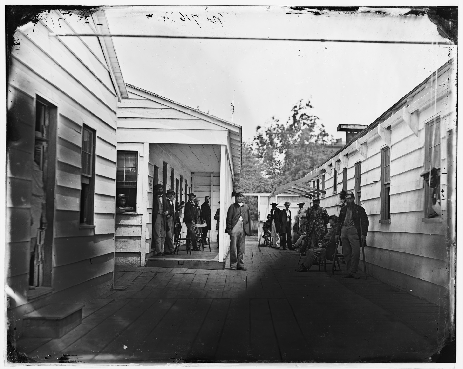 Convalescing soldiers and staff outside a Sanitary Commission lodge, one of 30 such facilities operated by the Commission in Washington during the war. Whitman didn’t think much of the Sanitary Commission.