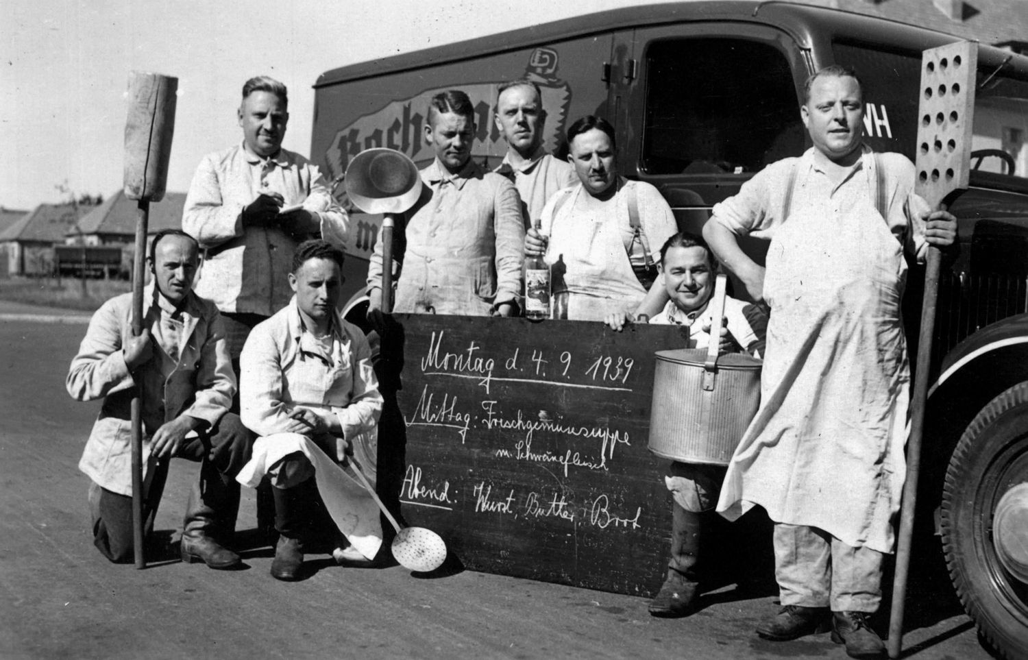 MENU FOR MONDAY—WORLD WAR II PLUS THREE DAYS: In a photo dated September 4, 1939, a cook’s unit proudly displays the tools of their trade and a menu board of the day’s repast for the troops. The relative tranquility of the photo belies the fact that just three days earlier, on September 1, German forces had invaded neighboring Poland, followed two days later by the declaration of war on Germany by Britain and France and thus the beginning of World War II. 