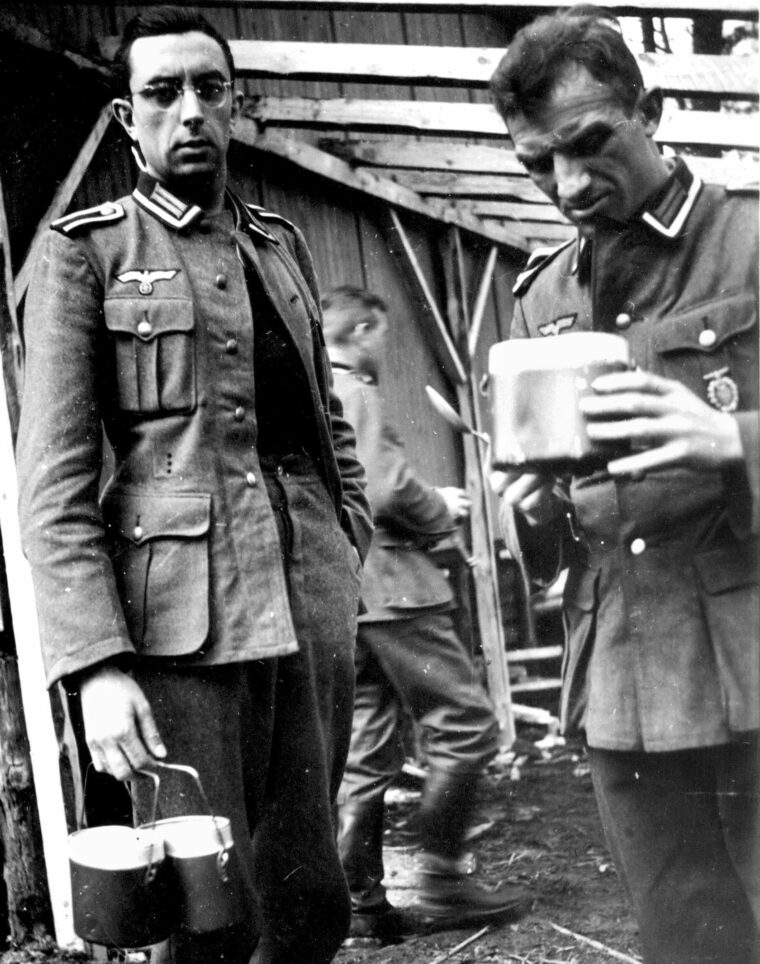Wearing a universally understood expression, a German soldier contemplates the contents of his field meal container.  One term used to describe a meatless, flavorless soup was Horst Wessel Suppe, the ground troops’ sardonic name referring to the “empty” story of an early SS man’s martyrdom, the basis for the “Horst Wessellied,” the Nazi Party’s official song. 