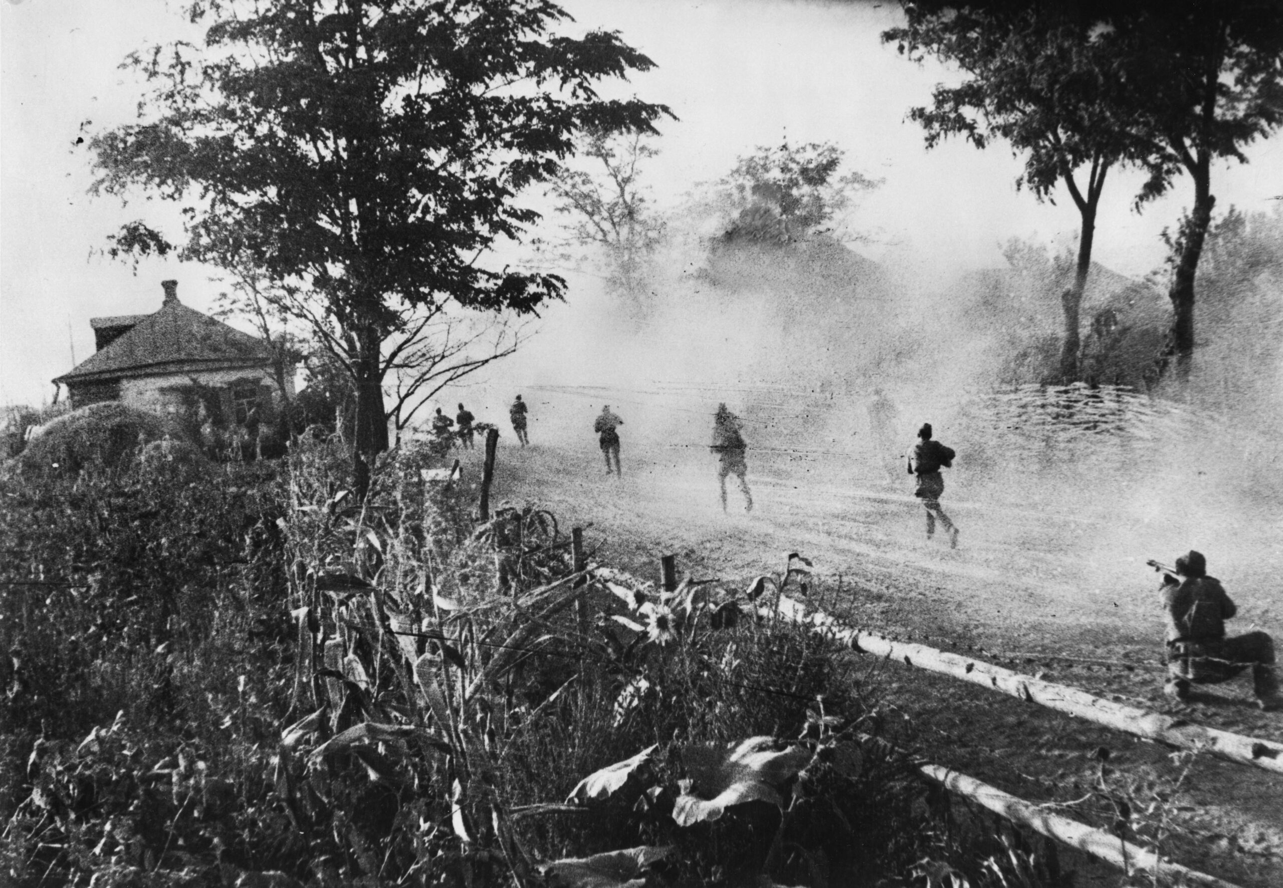 In this photo taken on August 12, 1943, Red Army infantrymen advance down a dirt road near the embattled city of during the Soviet Rumyantev offensive. 