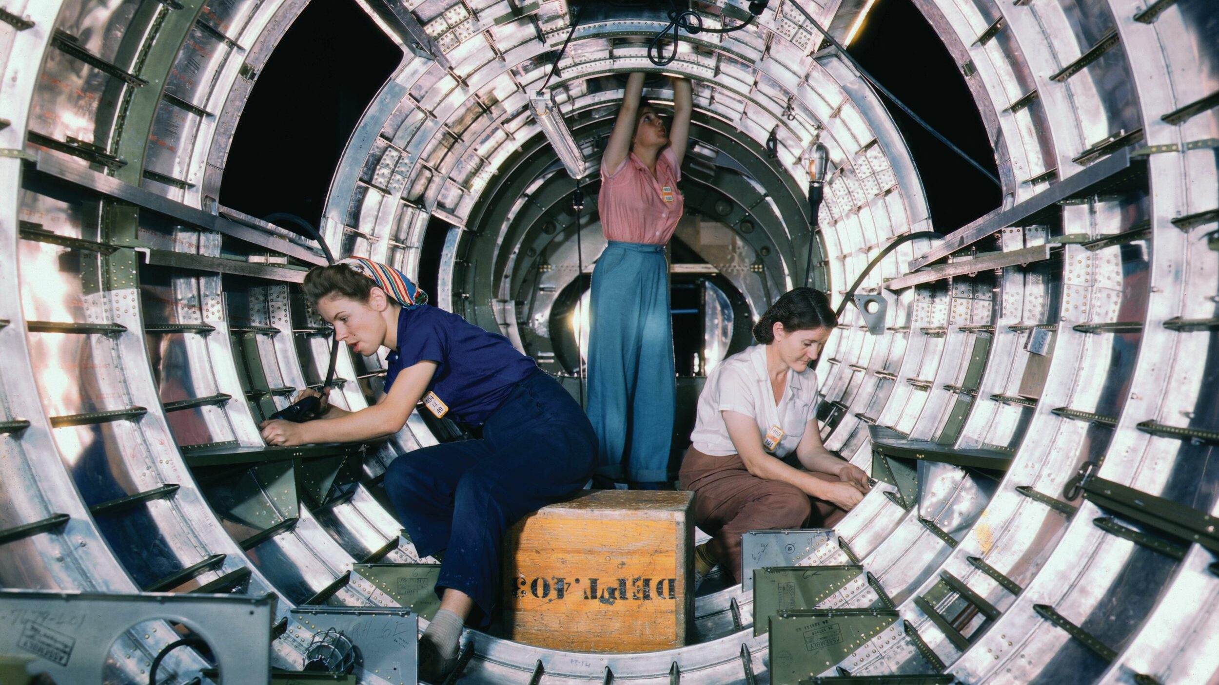 Women install fixtures and assemblies in the fuselage section of a B-17 Flying Fortress bomber at the Douglas Aircraft Company plant in Long Beach, California. This photo is one of a series taken in 1942 by Alfred T. Palmer. With wartime industries severely impacted by the loss of male workers to the armed services, women stepped forward to fill the gaps—and forever changed American society.