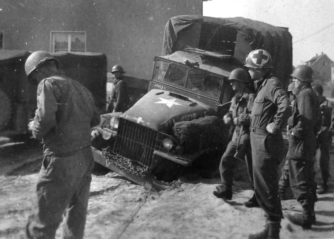 The effects of what the Russians call rasputitsa (sea of mud) that occurs due to spring snowmelt. Here a kitchen truck belonging to the reconnaissance company attached to battalion headquarters is stuck in hardened mud. (Photo taken April 21, 1945, in Halberstadt, Germany.)