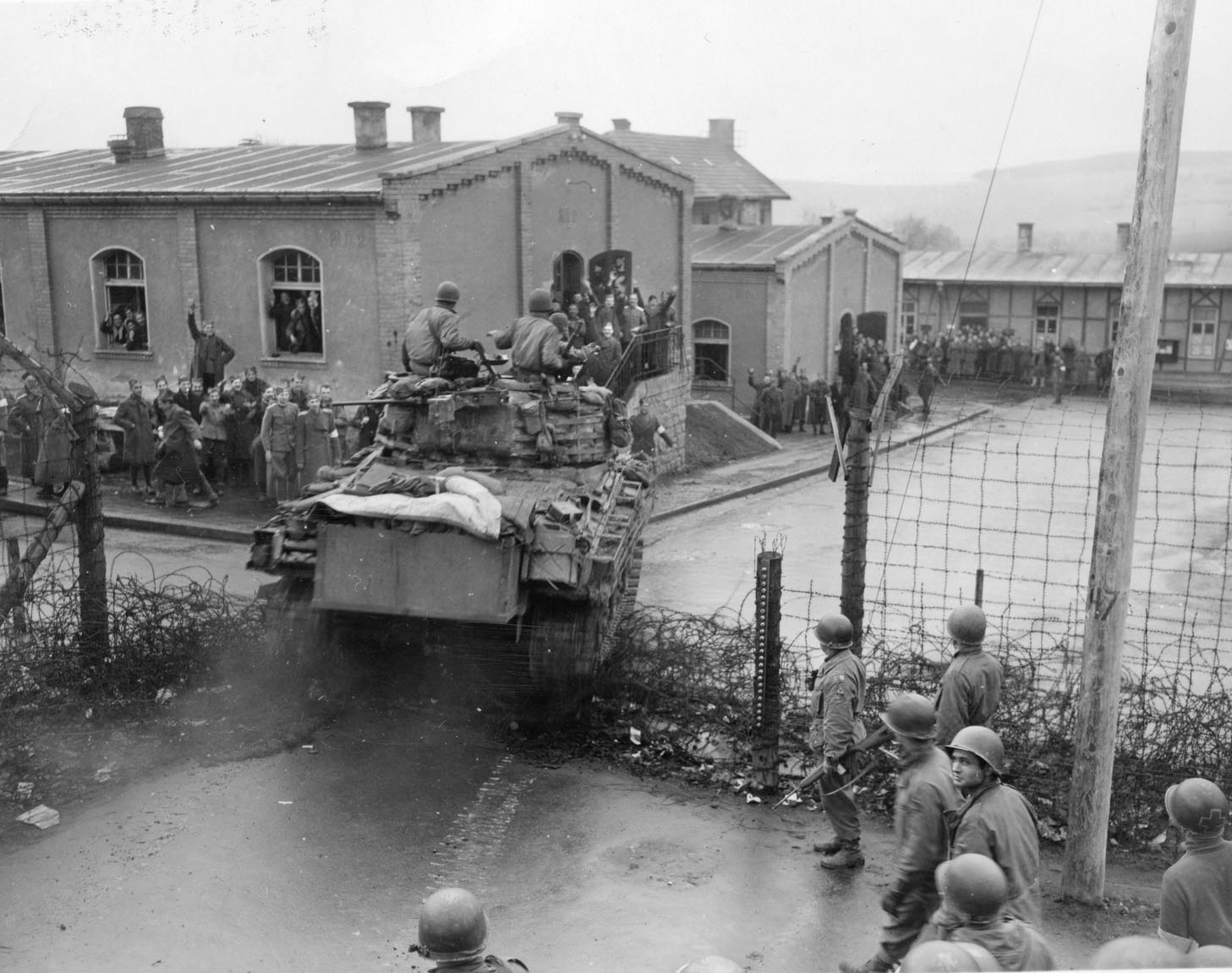 An American Sherman tank of Task Force Baum crashes through a gate at the Hammelburg POW camp during Patton’s abortive attempt to rescue American soldiers and his son-in-law, Lt. Col. John K. Waters. Thomas Flynn was one of the POWs held at Hammelburg.