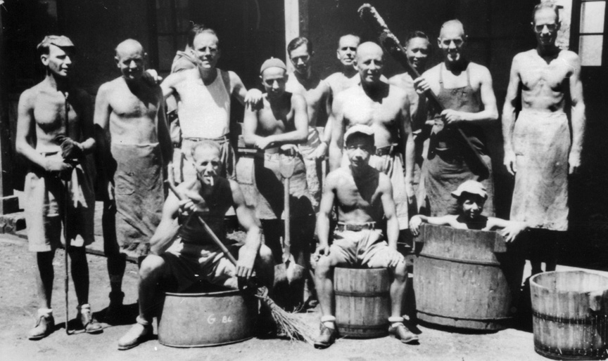 A group of kitchen workers at Lungwha strike a carefree pose. Joan’s father, John, is standing at far left.