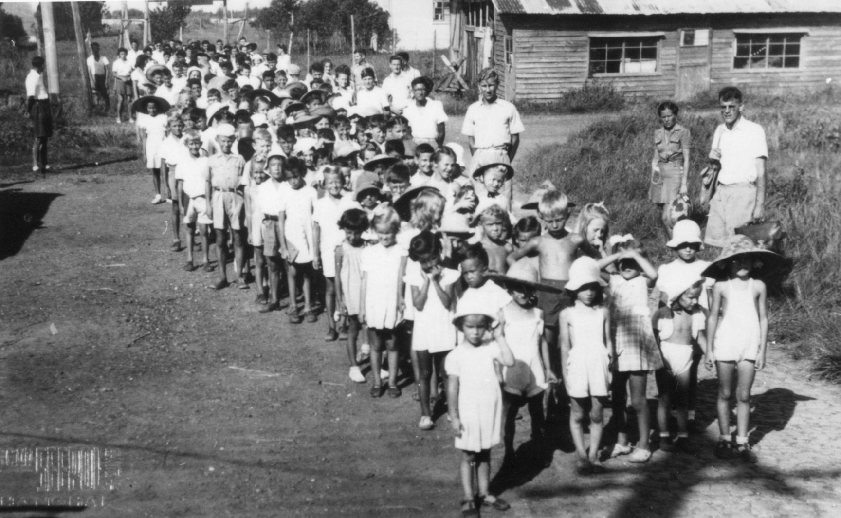 Interned foreign children on their way to school in the Lungwha camp in Shanghai, China. Joan Borsberry attended the school. 